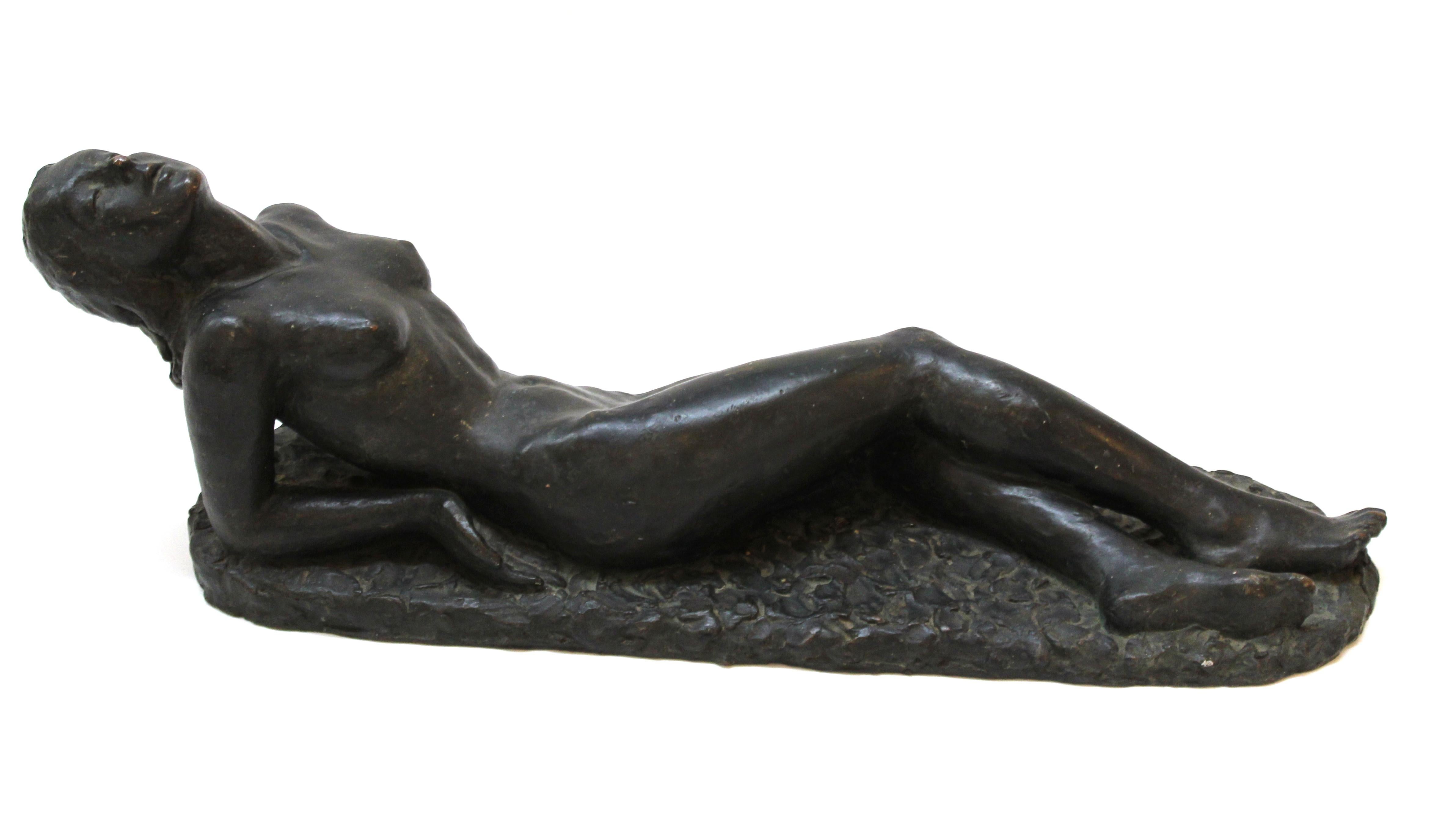 Classical late Art Deco period sculpture of a nude reclining woman sculpted by Lilly Rona, (Austrian-American 1893-1958). The piece is made in bronze patinated plaster over red clay. Signed and dated 1940 on the back of the base. In great vintage