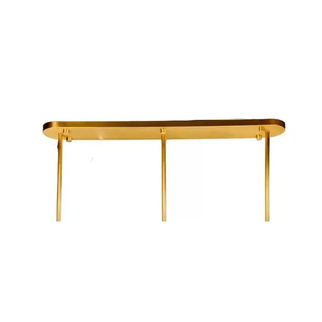 The Lilly Chandelier beautifully captures the essence of the lily flower in a seamless blend of nature-inspired design and minimalistic elegance. Its textured brass body and crystal accents reflect light in a mesmerizing way, adding a warm, inviting