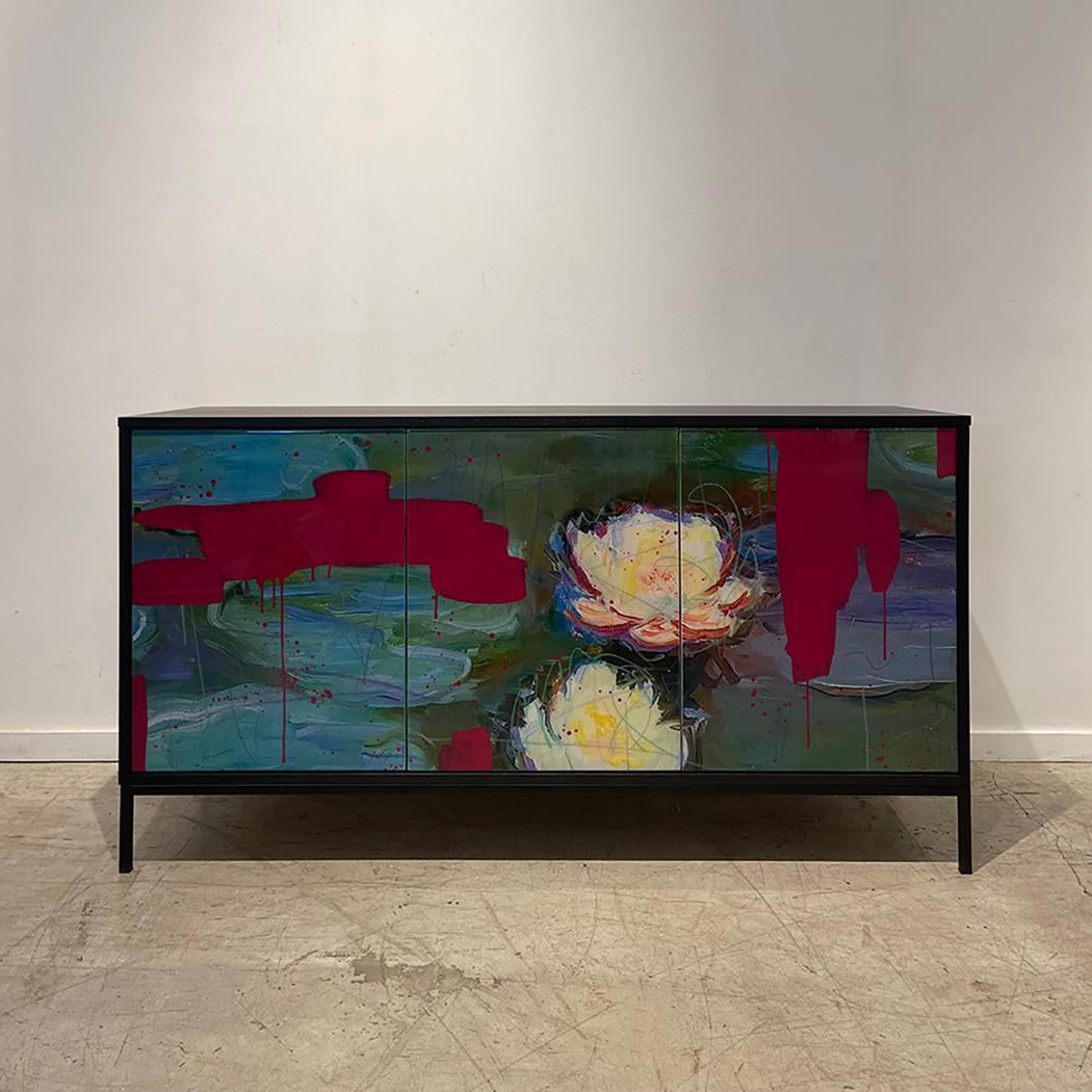 Lily Abstract Credenza by Morgan Clayhall, is created and finished by hand in our Toronto studio

We have used a portion of a classic painting. We digitally manipulated it and then added our classic graffiti to the image, creating a one kind piece