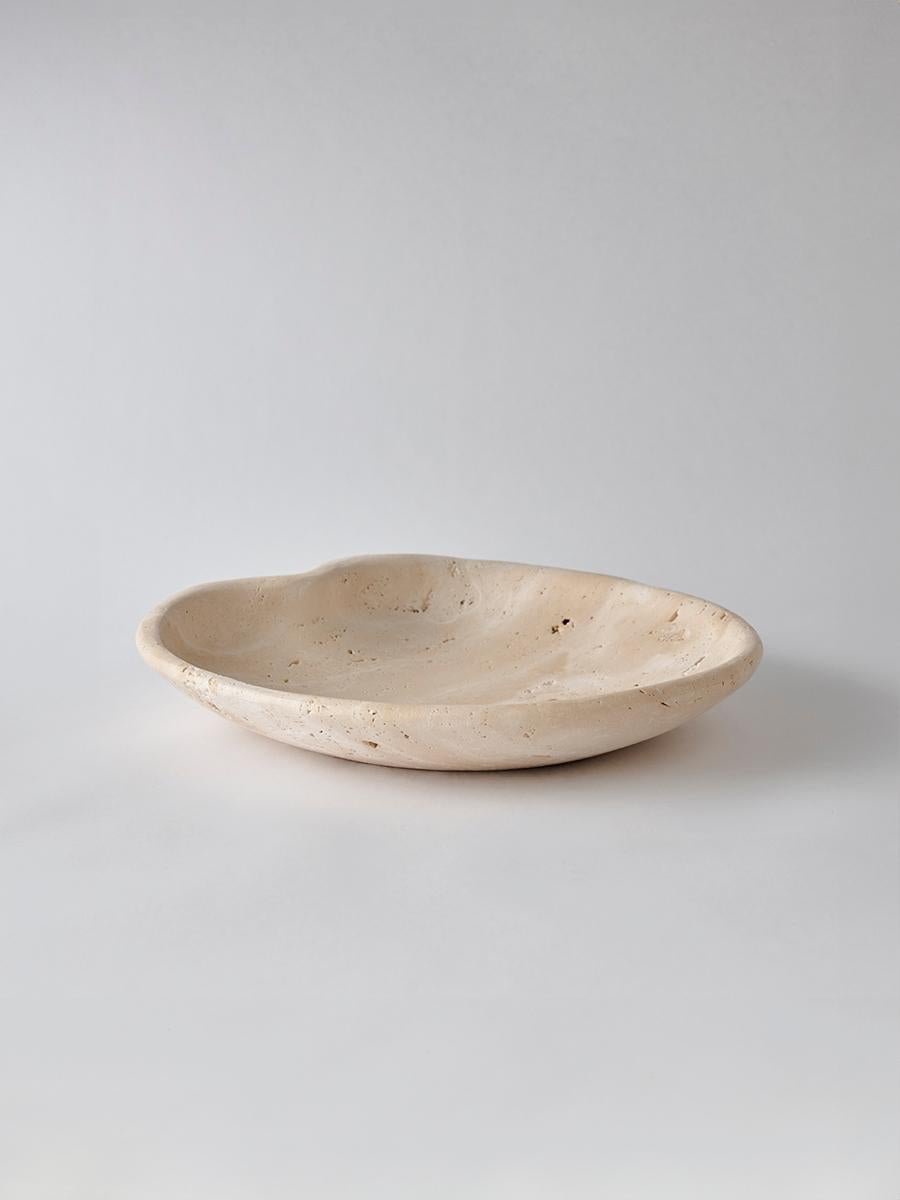 With softly undulating edges reminiscent of floating lily pads, the Lily Bowl brings a sculptural elegance to any surface. Carved from one of four types of natural marble, this design is a delicate fusion of classic materials and modern