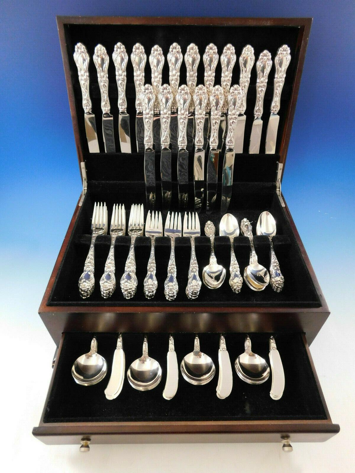 Monumental Lily AKA Floral by Frank Whiting sterling silver Flatware set - 108 pieces. This popular pattern was introduced in the year 1910. This set includes:

18 knives, wide handles, 9