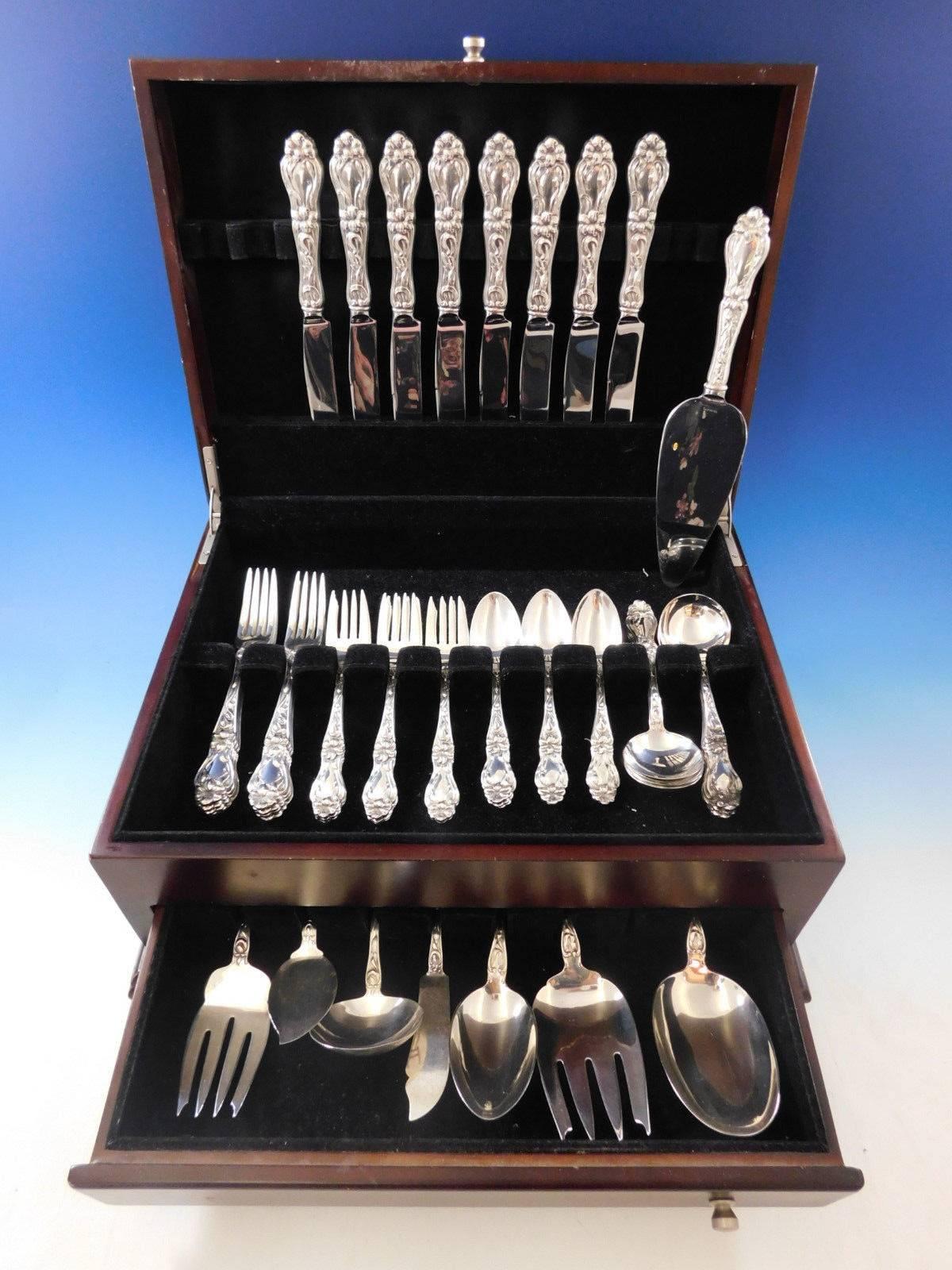 Stunning Lily aka floral by Frank Whiting sterling silver flatware set - 48 pieces. This popular pattern was introduced in the year 1910. This set includes:

Eight knives, 9