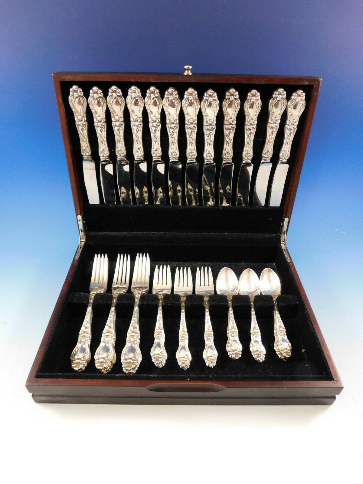 Dinner size Lily by Frank M. Whiting sterling silver flatware set, 48 pieces. This set includes:

 12 dinner size knives, 9 7/8
