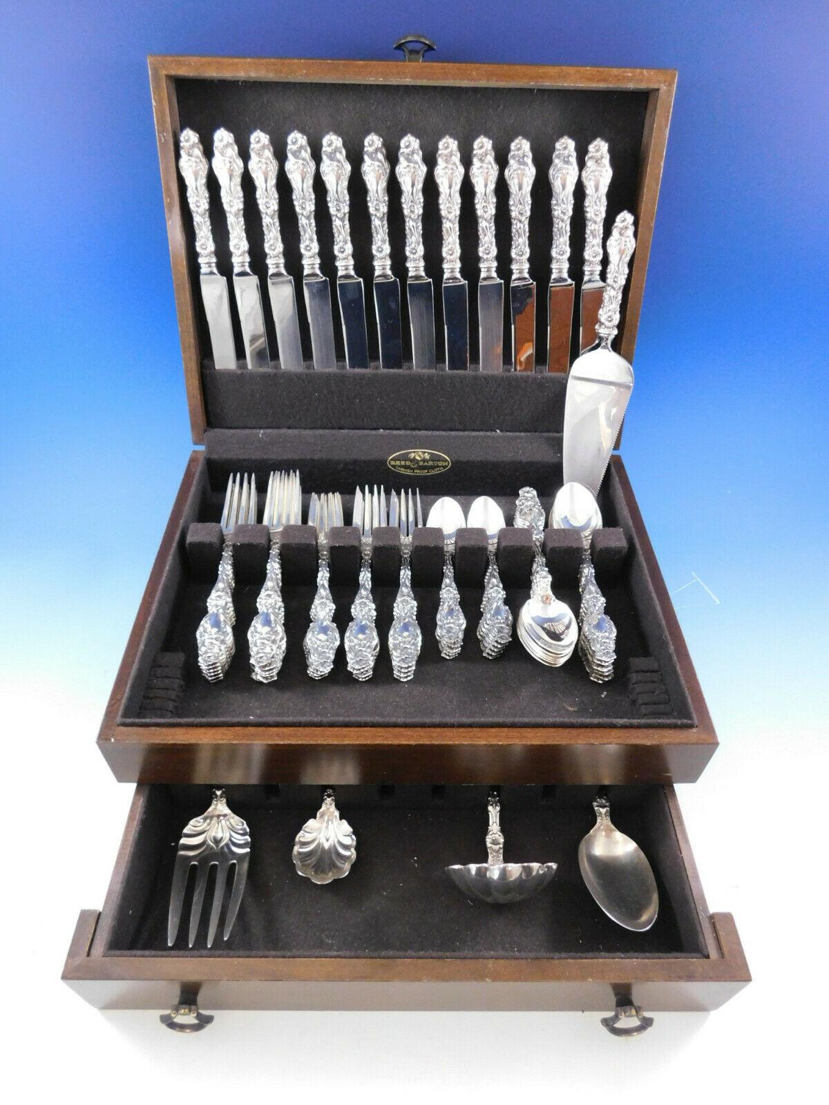 Dinner size lily by Gorham-Whiting sterling silver flatware set - 65 pieces. All of the pieces in this set have the newer Gorham hallmark, except for 2 teaspoons, which are hallmarked Whiting.

This set includes:

12 dinner knives, 9 3/8