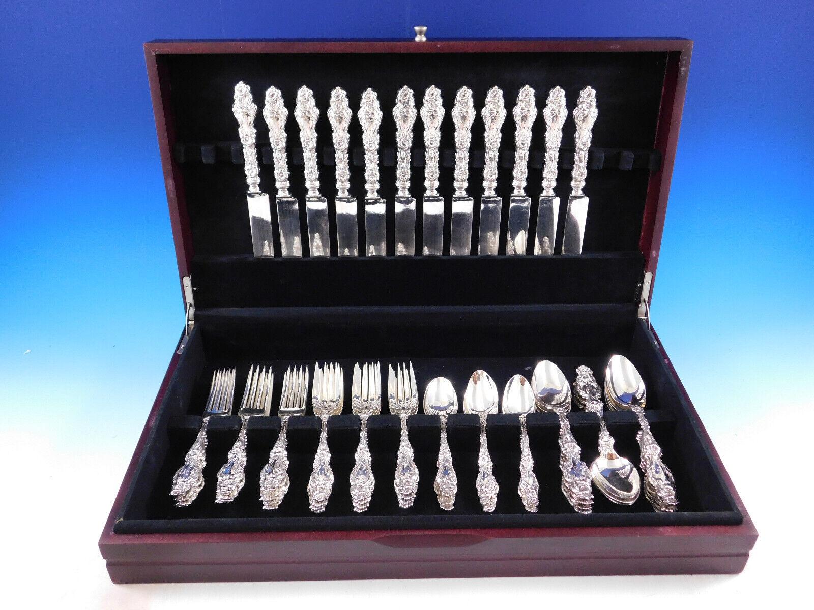 Beautiful Lily by Whiting Sterling Silver Flatware set - 60 pieces. This set includes:

12 Knives with blunt silverplated blades, 9