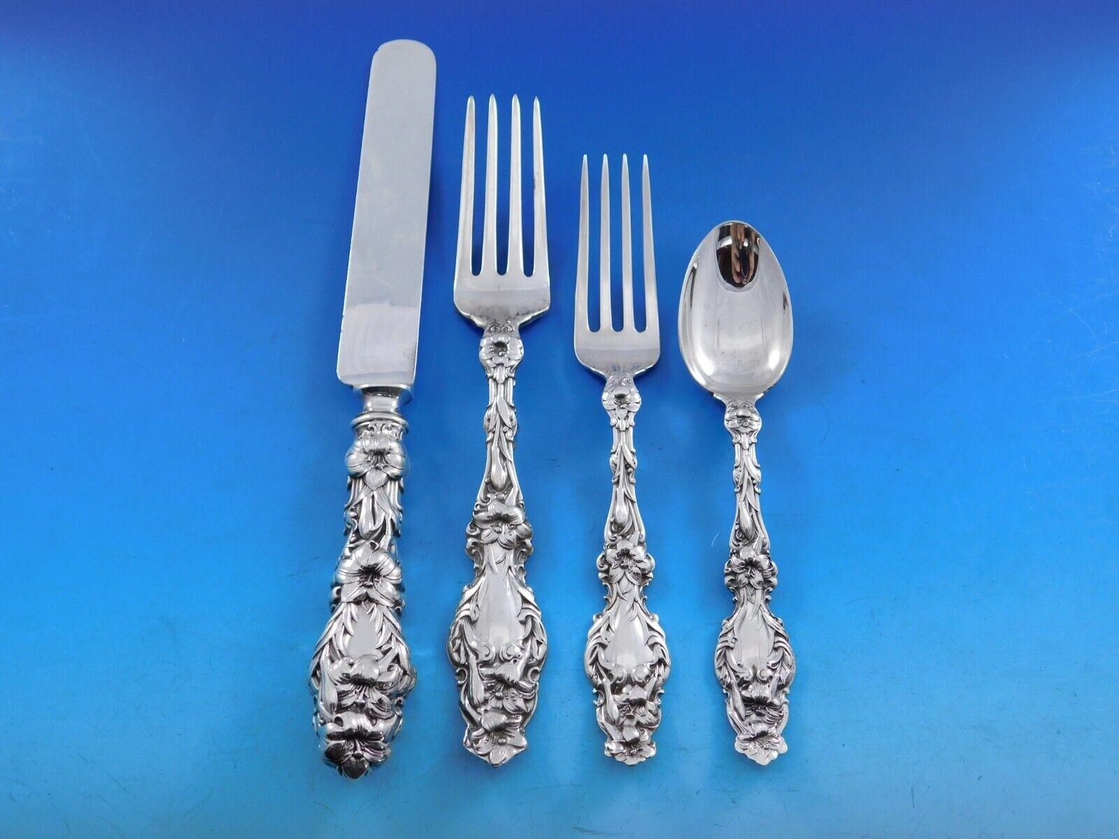 Gorgeous Dinner Size Lily by Whiting Sterling Silver Flatware set - 65 pieces. This set includes:

12 Dinner Size Knives with fabulous early hand cast handles and Blunt plated blades, 9 7/8