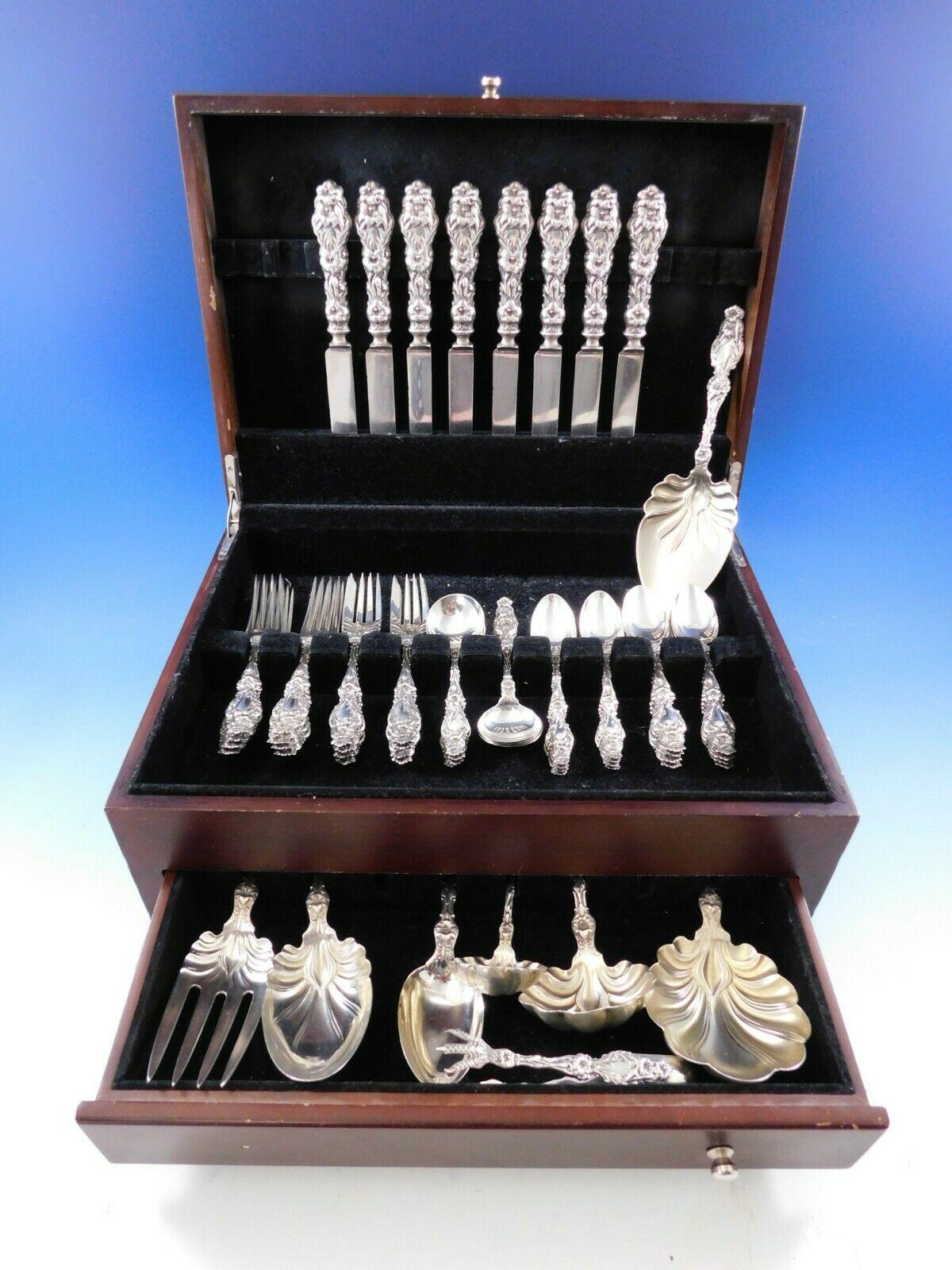 Masterfully crafted Lily by Whiting sterling silver flatware set, 56 pieces. This set includes:

8 knives with early thick handles and blunt plated blades, 8 3/4