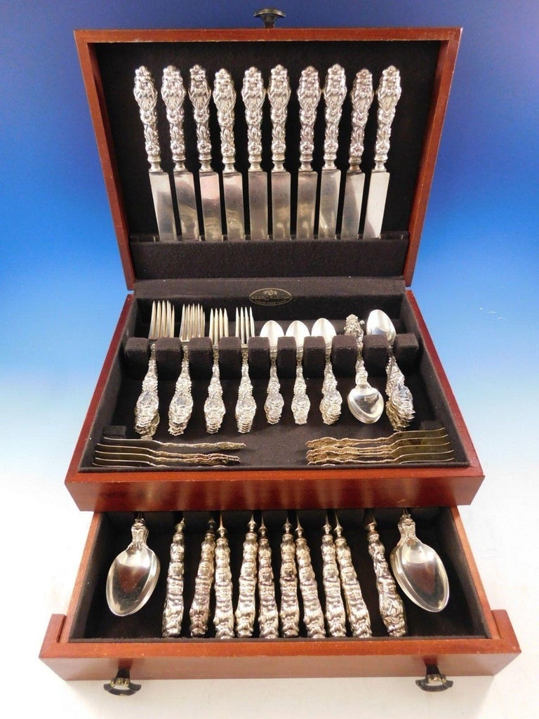 Lovely early Lily by Whiting sterling silver flatware set with matching script monogram, 80 pieces. This set includes:

10 dinner knives, hand cast handle, 9 3/4