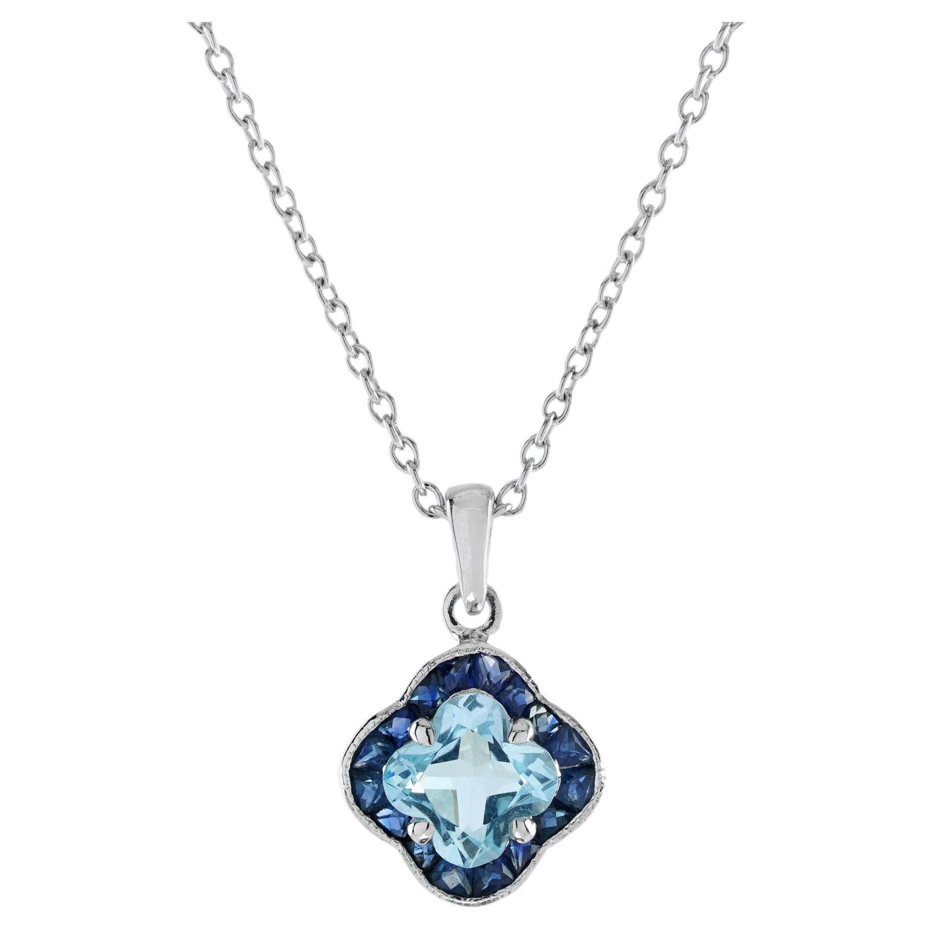 Collier pendentif en or blanc 9K avec topaze bleue et saphir bleu taillés en forme de lys