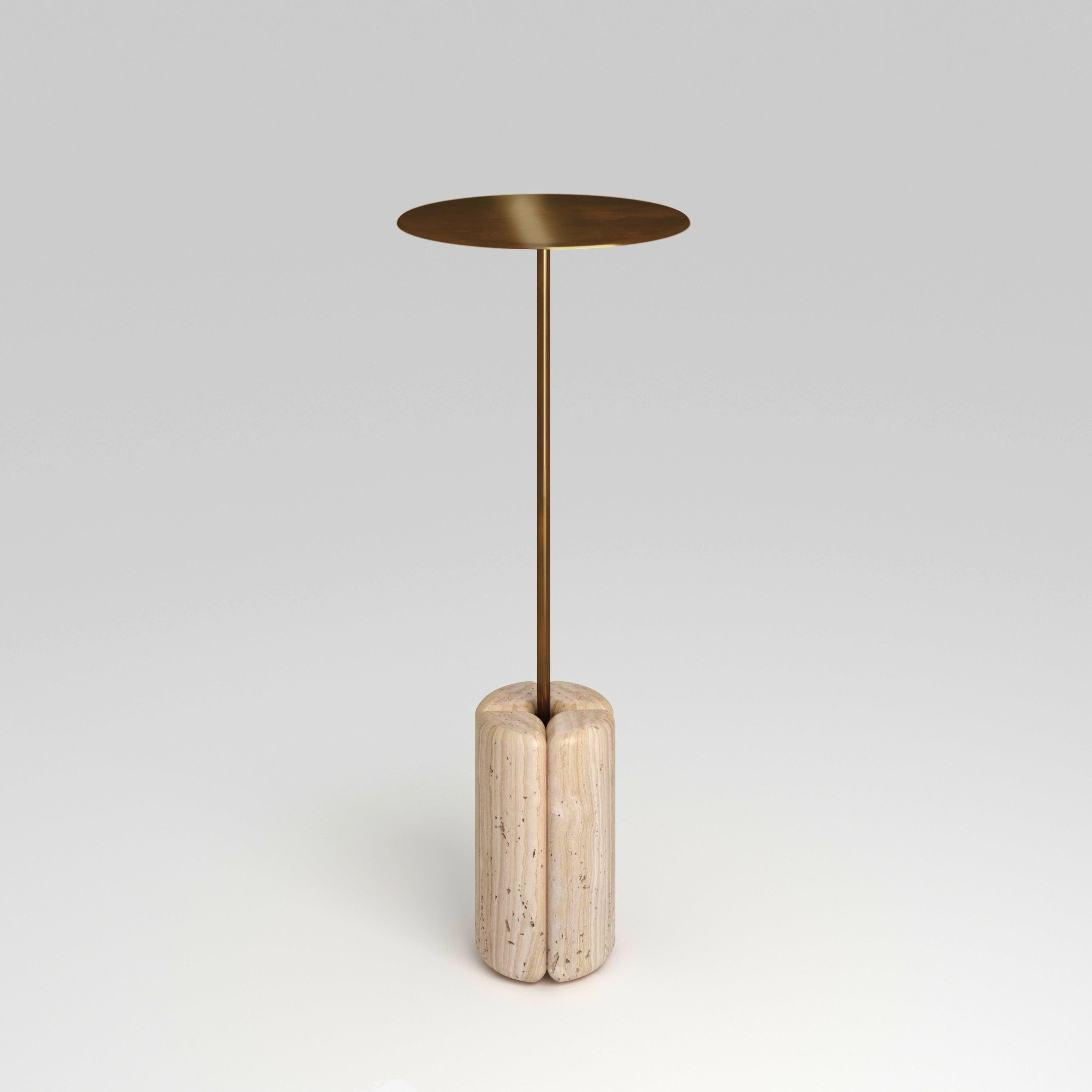 Lily Drink Table by Fred and Juul
Dimensions: Ø 24 x H 60 cm.
Materials: Navona travertine and brass.

Fred&Juul, short for Federico Minarelli and Julie Janssen, are two architects who decided to work as architects isn’t for them. It was when