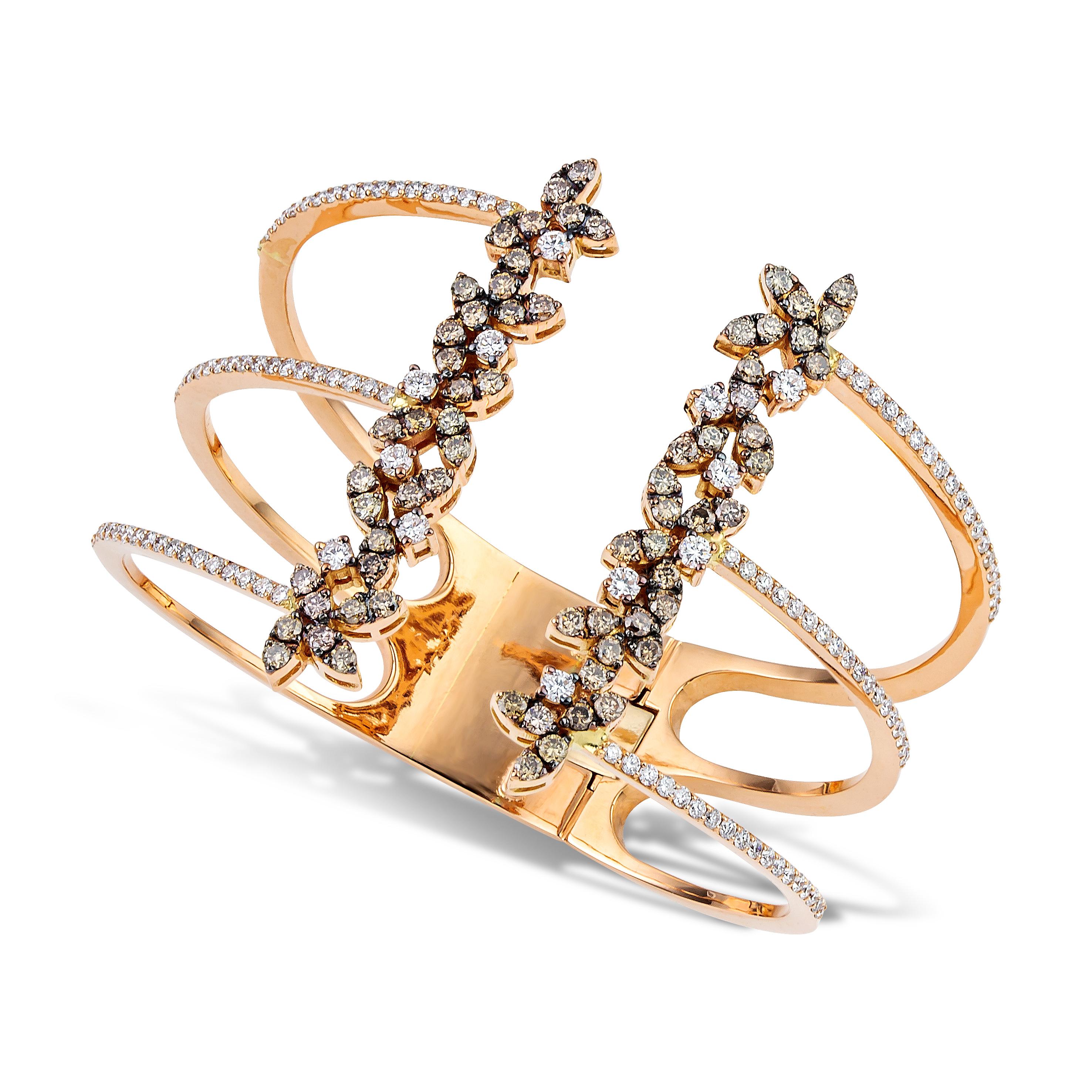 Unique cage cuff bracelet handcrafted in 18Kt rose gold, white and brown brilliant cut diamonds 6,72 carat create elegantly the shape of Lily flowers in bloom in the edges of the bracelet. Lines of pave diamonds in the shoulders of the bracelet,
