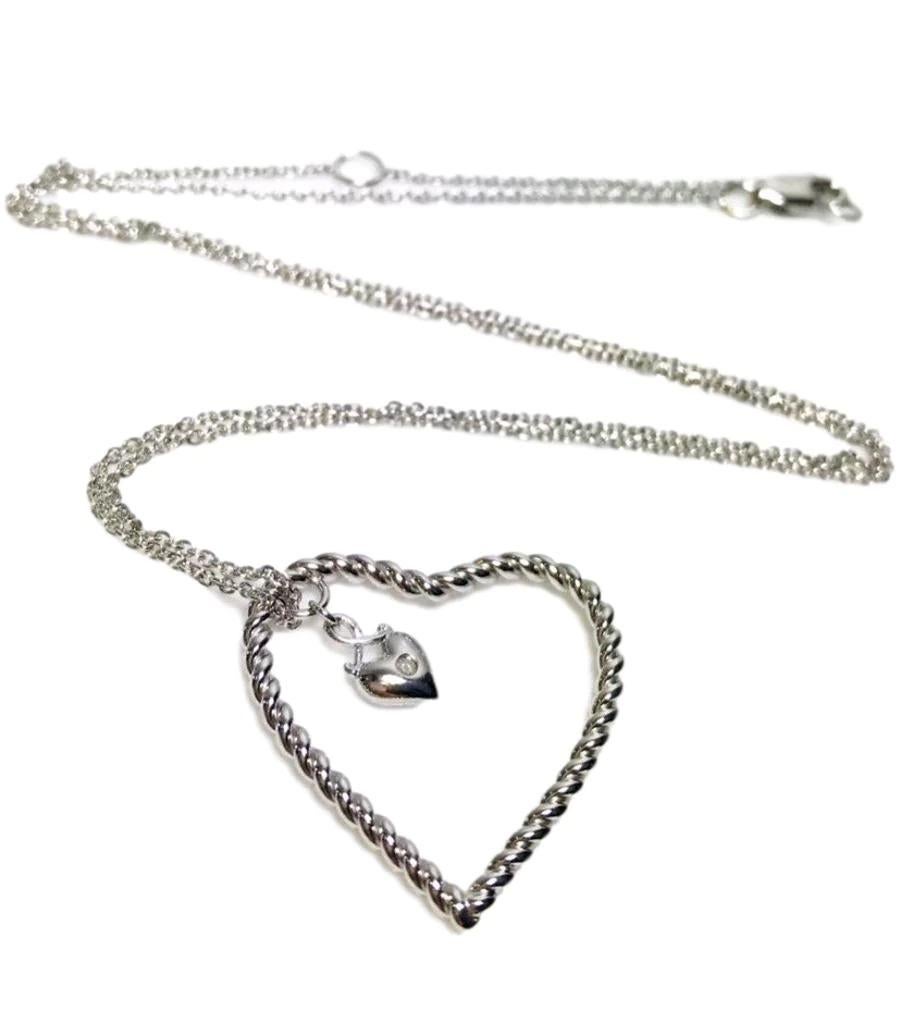 Lily & Lotty Silver Necklace with Open Heart Diamond Pendant

Twisted rope style heart with a smaller heart which has a diamond.

Additional information:
Size – One Size
Condition – As New in box