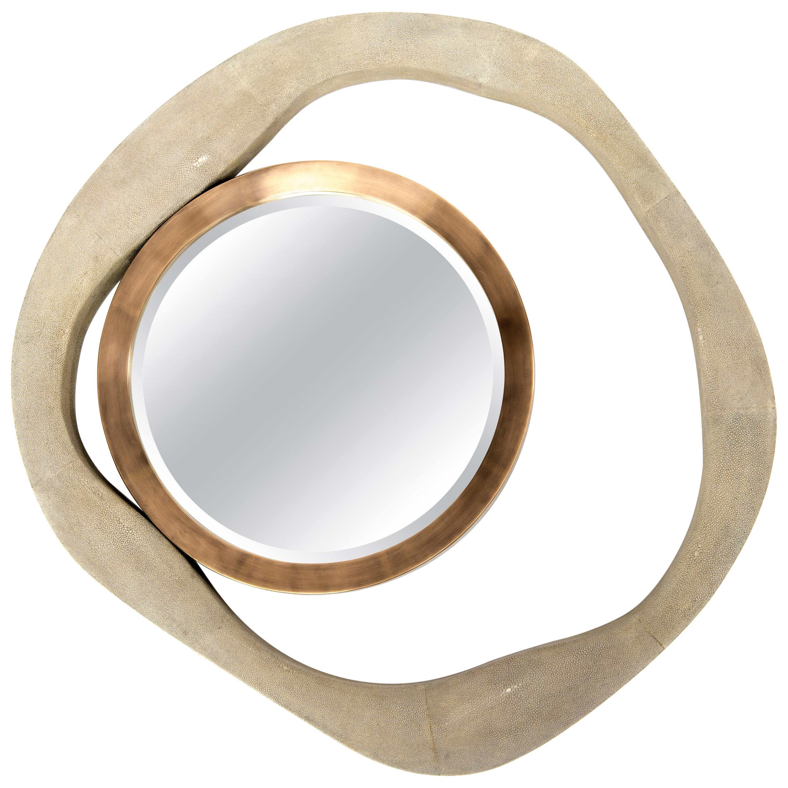 The lily mirror by R & Y Augousti in shagreen and bronze-patina brass, is an iconic piece of theirs and is an extremely versatile mirror. Due to the fixtures at the back this piece can be hung in three different ways creating a different expression