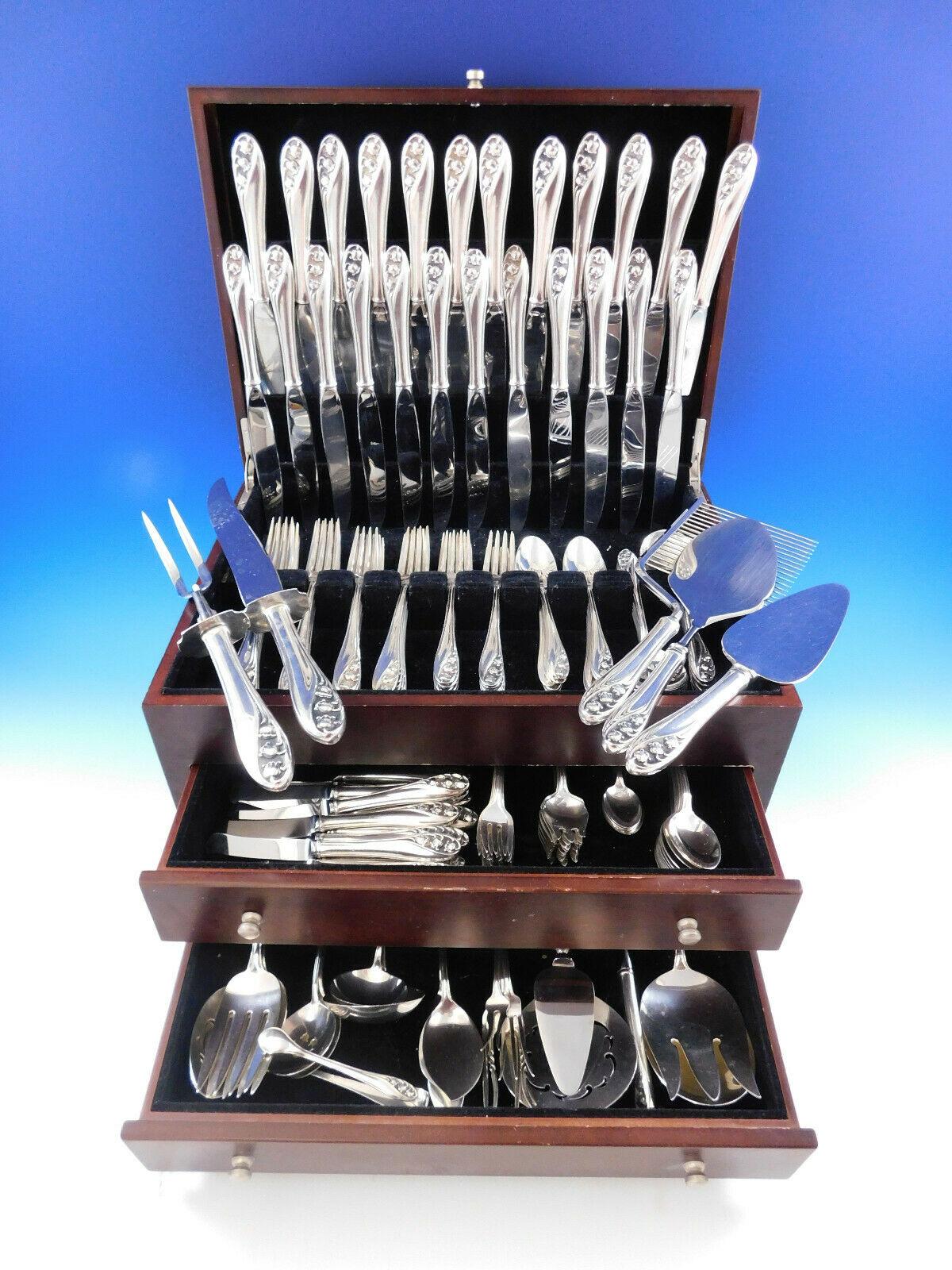 Monumental Dinner & Luncheon Size Lily of the Valley by Gorham, circa 1950, sterling silver Flatware set, 170 pieces. This service for twelve features the delicate dimensional blooms of lily of the valley flowers along the top of the handles. This