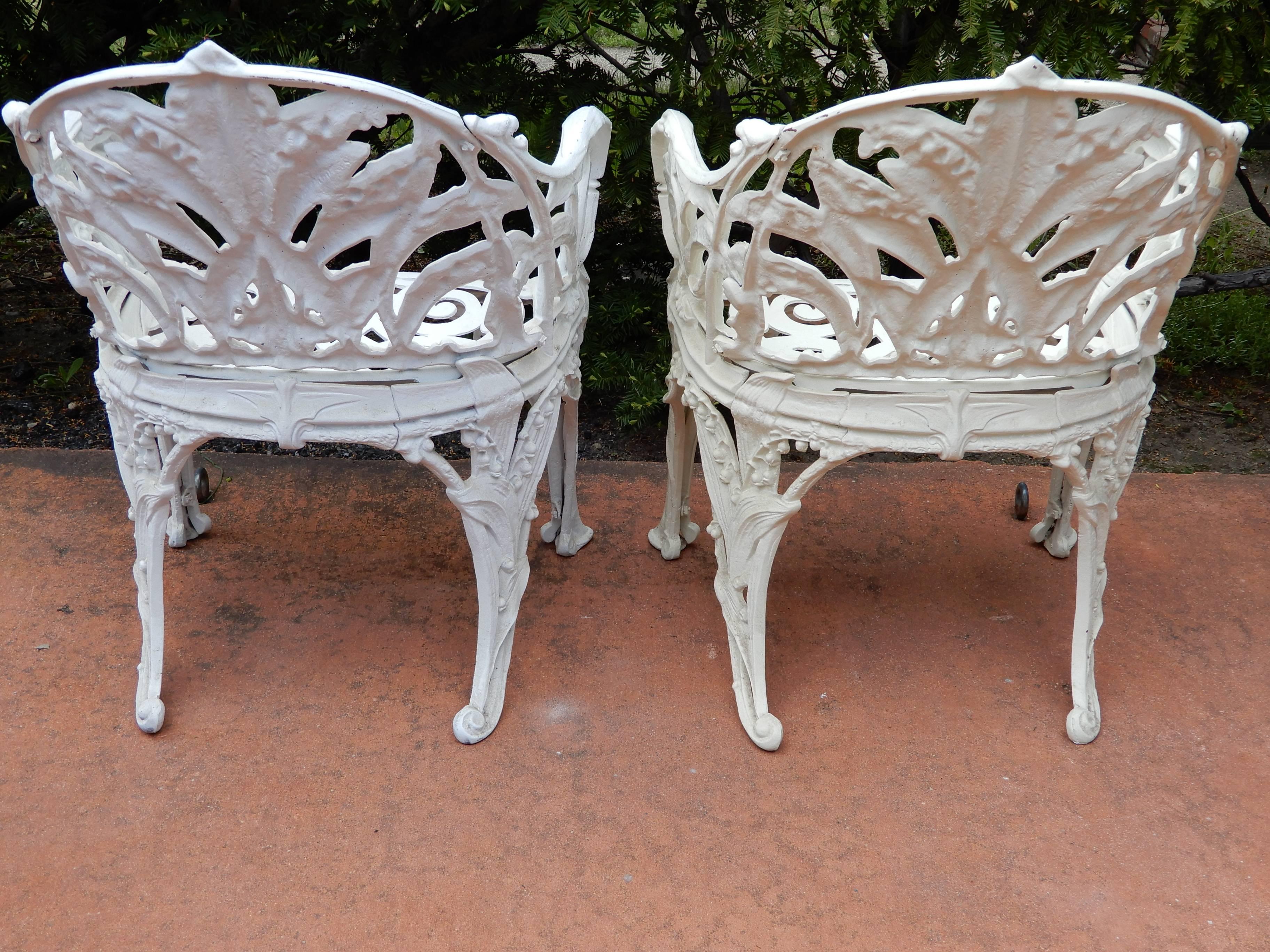 A pair of Lily of the Valley garden chairs. The lily of the valley chairs with naturalistic detail.
The chairs surprisingly are made of cast aluminum which makes them easier to move. The cast aluminum will not rust the way iron will and are