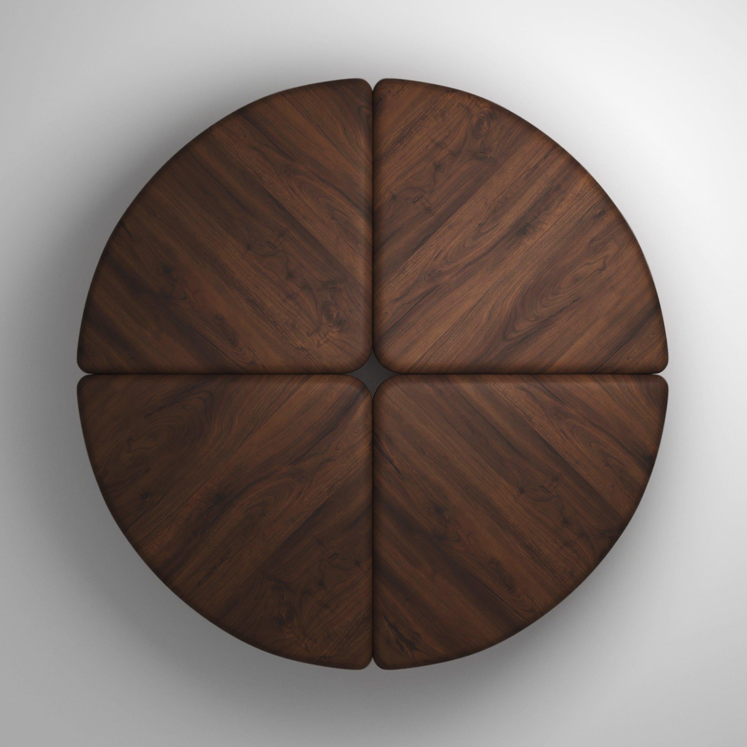 A coffee table handmade out of 30 mm thick solid Canaletto Walnut wood. Inspired by lily pads and their curled edges, it’s divided in 4 quarters, with each part’s rounded edges juxtaposed to the adjacent parts’ edges. Available in any size and