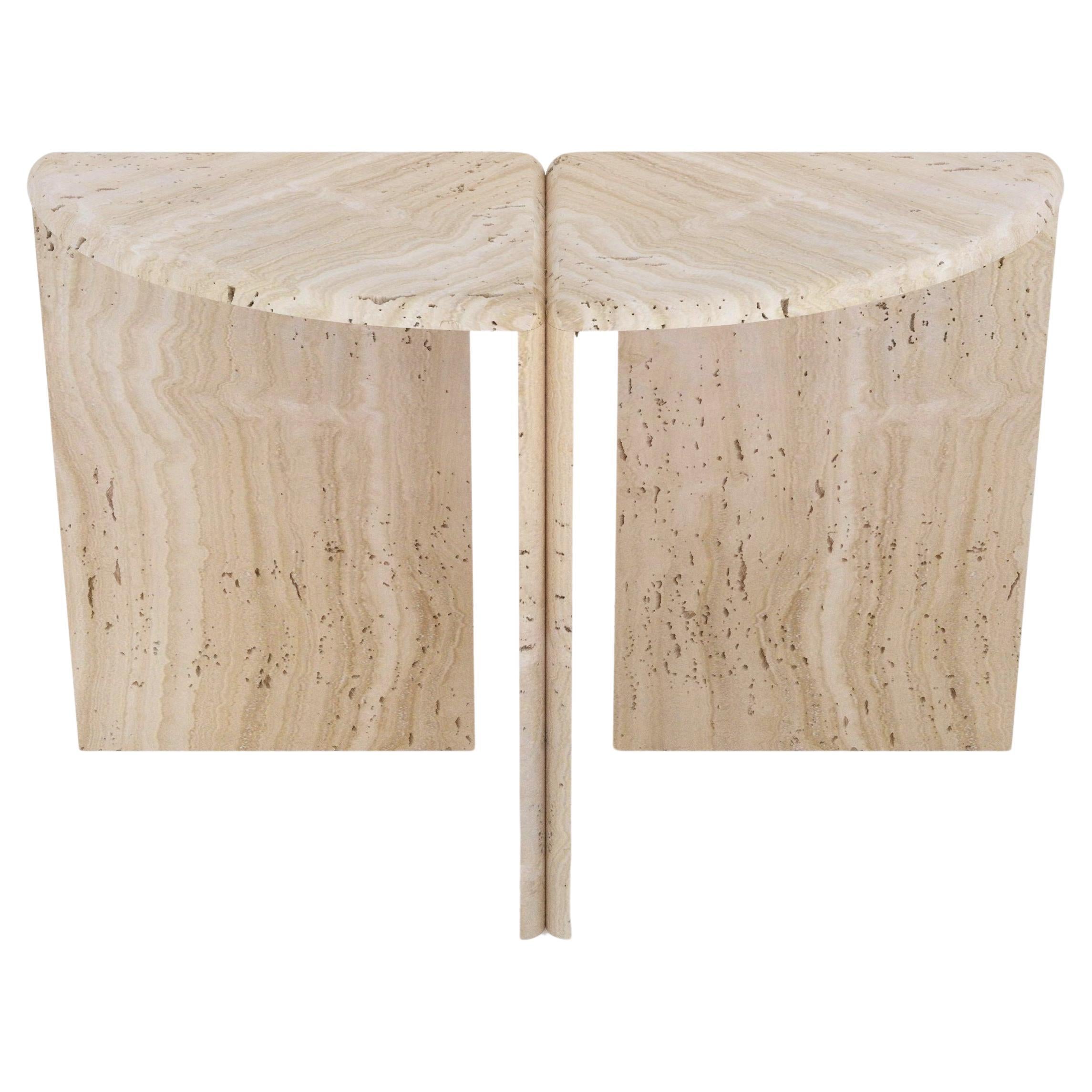 A console table handmade out of 30 mm thick honed unfilled Navona Travertine. Inspired by giant water lily pads and their curled rims, it's divided in 2 halves, with each part's rounded edges juxtaposed to the adjacent parts' edges. Available in any