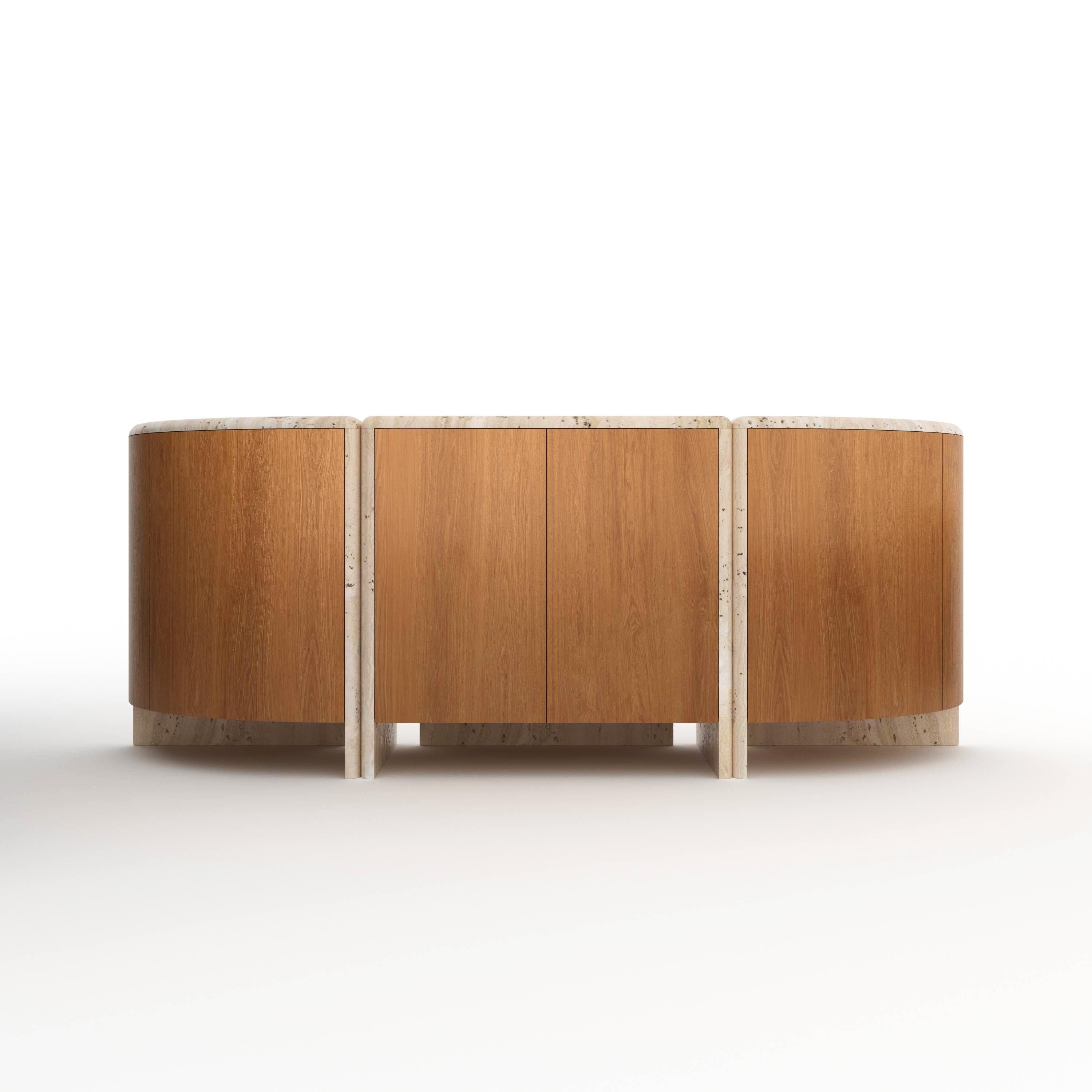 A credenza inspired by giant water lily pads and their curled rims, handmade out of 30 mm thick honed unfilled Navona Travertine with rounded, juxtaposed edges and Oak.
Available in any size and material of choice.

About Fred&Juul:

Fred&Juul