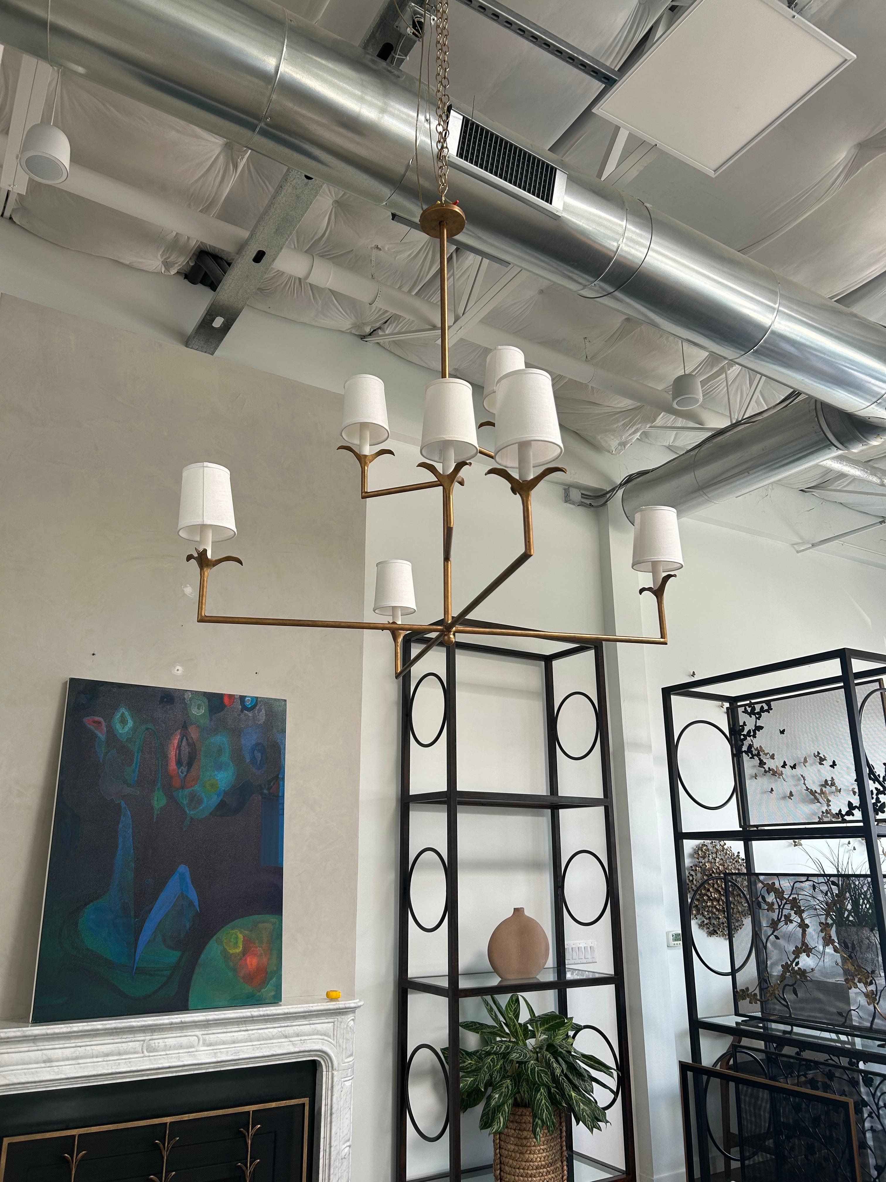 The Lily Stems Chandelier has a classic profile that fits almost any style and has great scale. The six slender arms emit softly diffused light from the center of individually formed and finished leaves, all made in-house.

The Lily Stems Chandelier