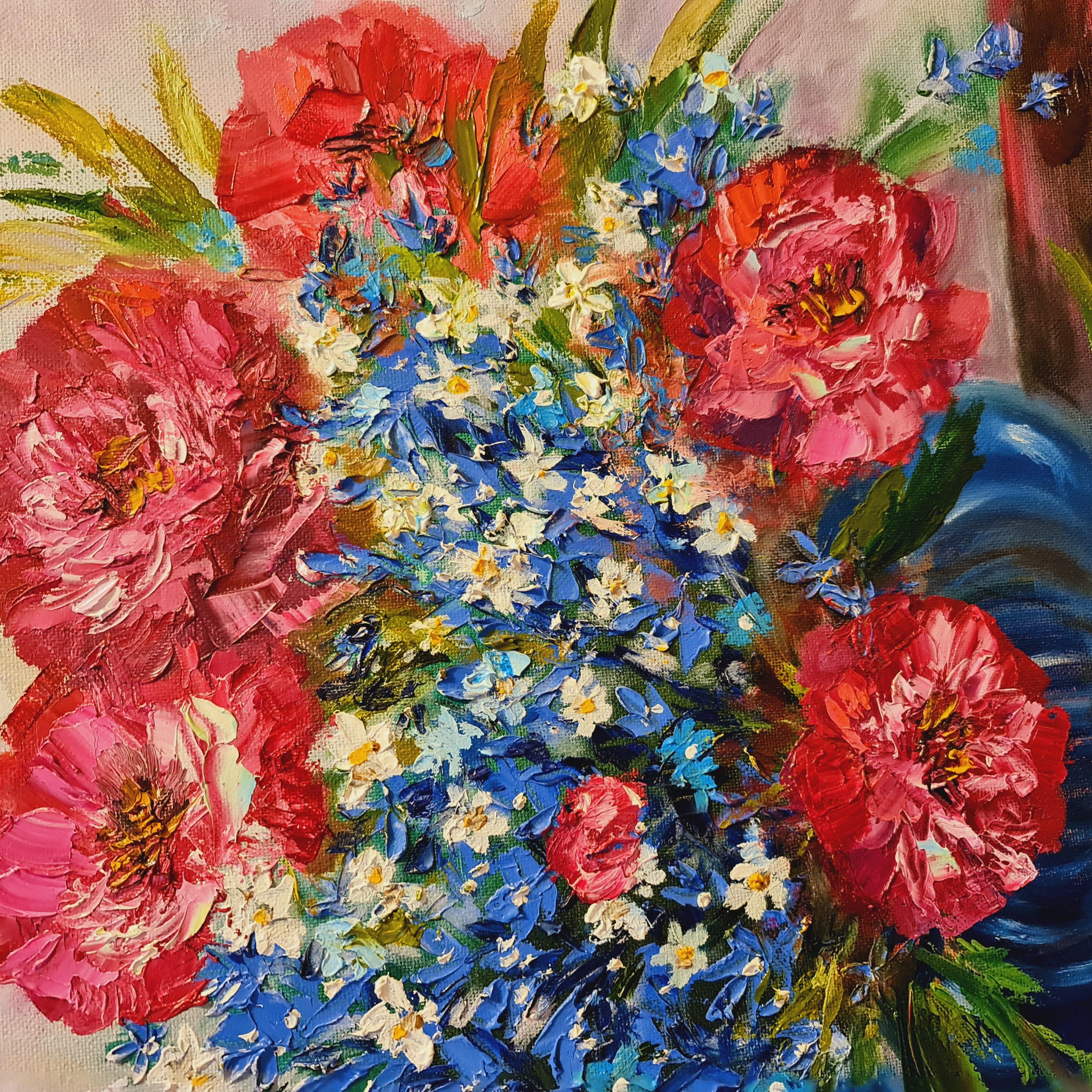 A gorgeous, luxurious lovely summer bouquet of flowers in a blue vase. Blue wildflowers of forget-me-nots grow at my mother's cottage. White flowers appeared in the forest, delicate. They smell like honey. And we can observe early peonies already at