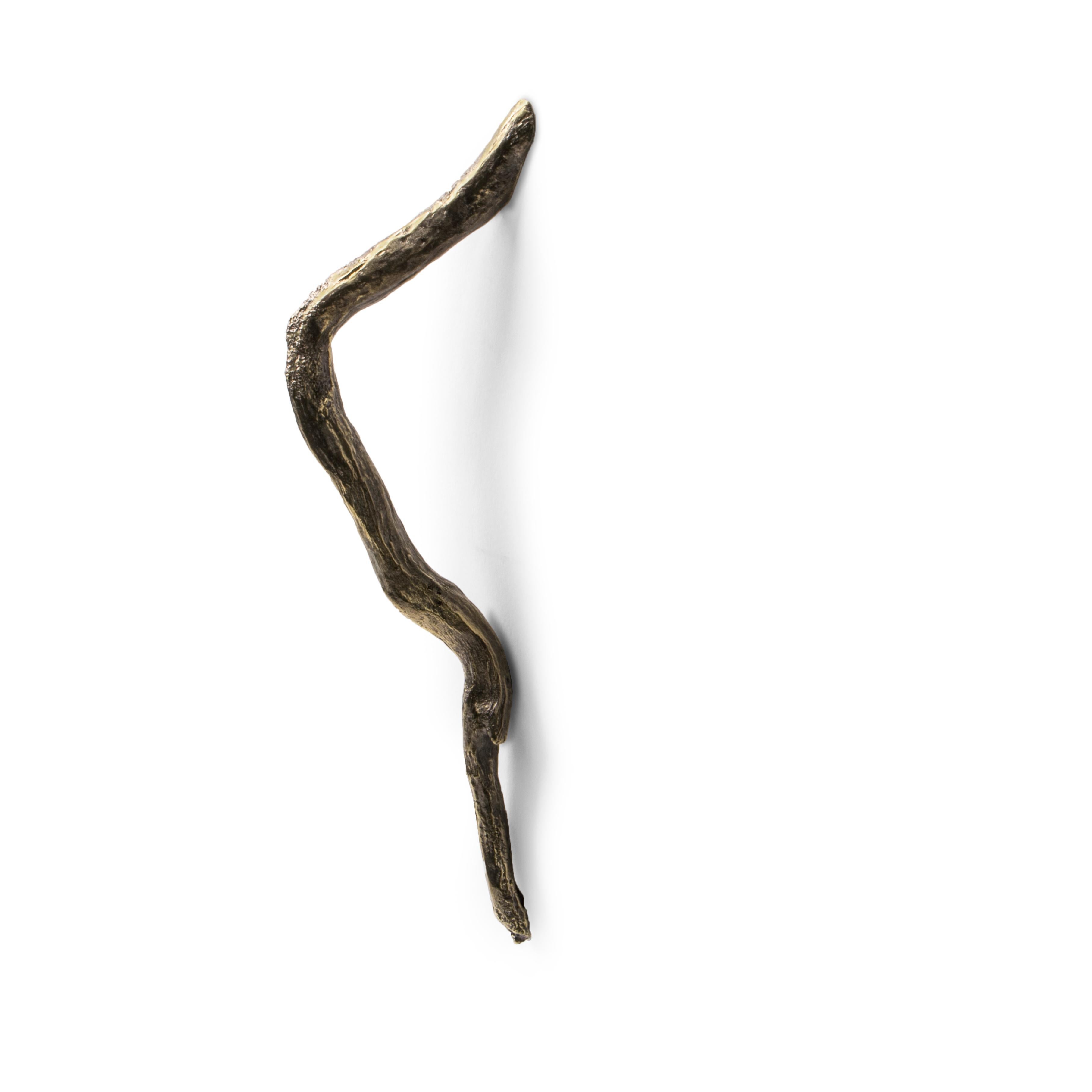 For the design of the Limb Door Hardware, the inspiration was the image of a white sand beach with an array of tree branches, grown in solid soil and brought out to us by the strength of the blue sea. Driven by the natural cycles we shaped Limb