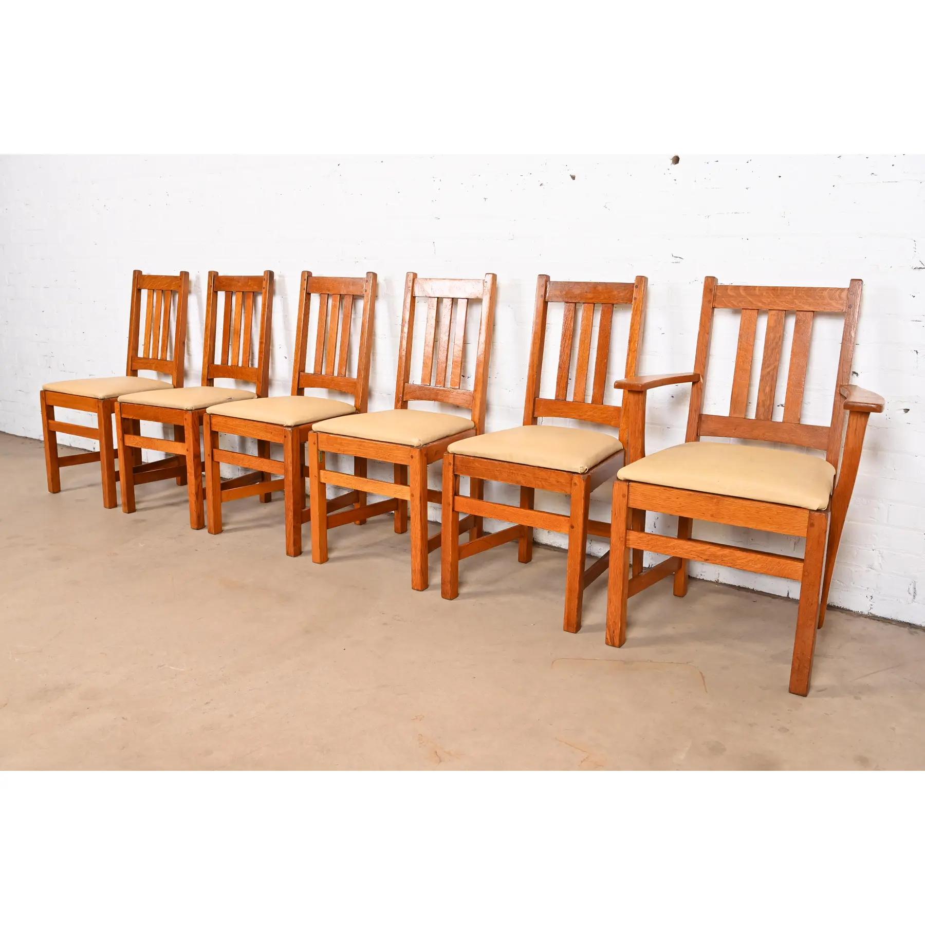A beautiful set of six of Mission or Arts & Crafts period dining chairs

By Charles P. Limbert Co.

USA, Circa 1910

Solid quarter sawn oak frames, with upholstered seats.

Measures:
Side Chairs: 17.5