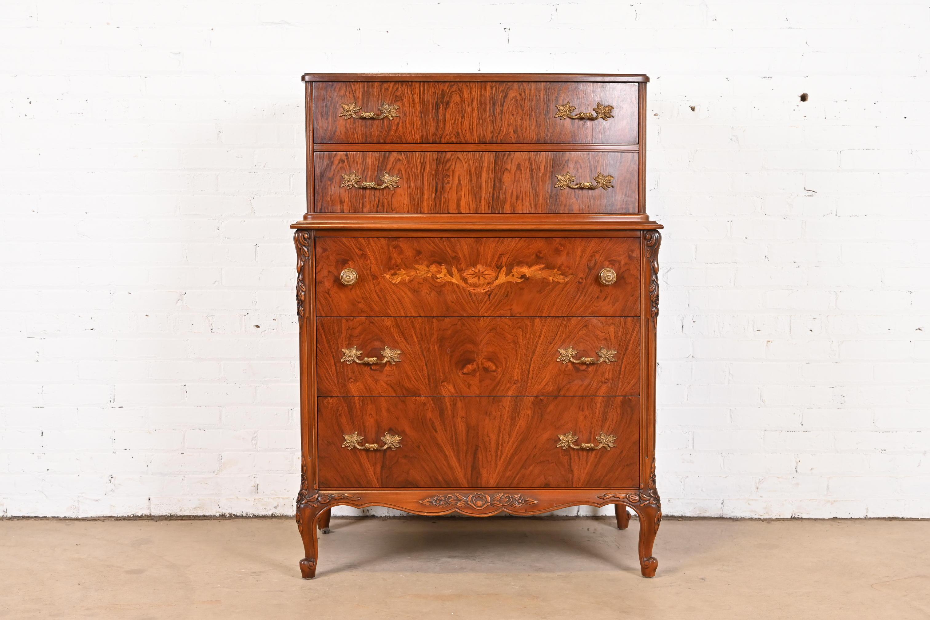 A gorgeous French Provincial Louis XV style highboy dresser

By Limbert

USA, 1920s

Beautiful book-matched rosewood, with inlaid satinwood marquetry, and original brass hardware.

Measures: 36