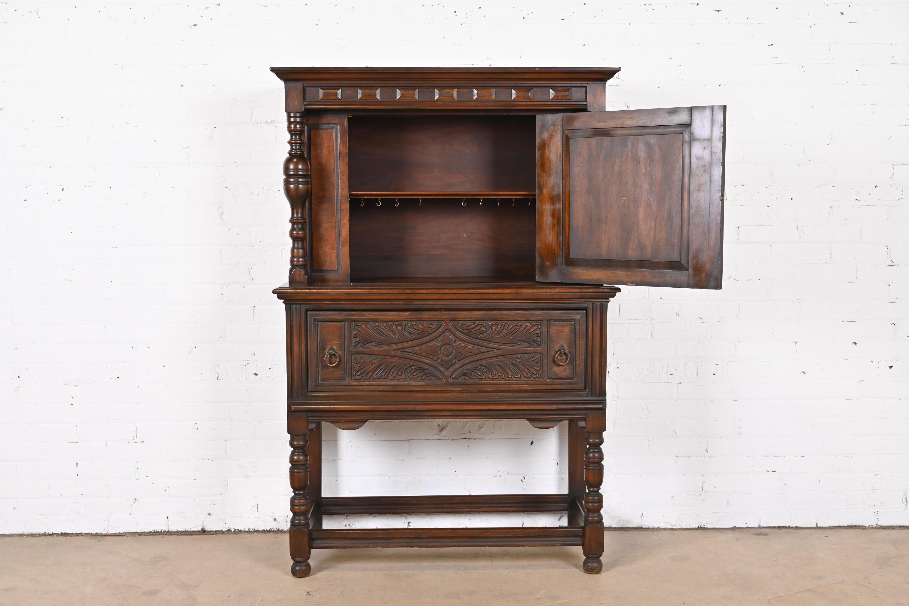 Early 20th Century Limbert Jacobean Carved Walnut Hutch or Bar Cabinet, Circa 1920s For Sale