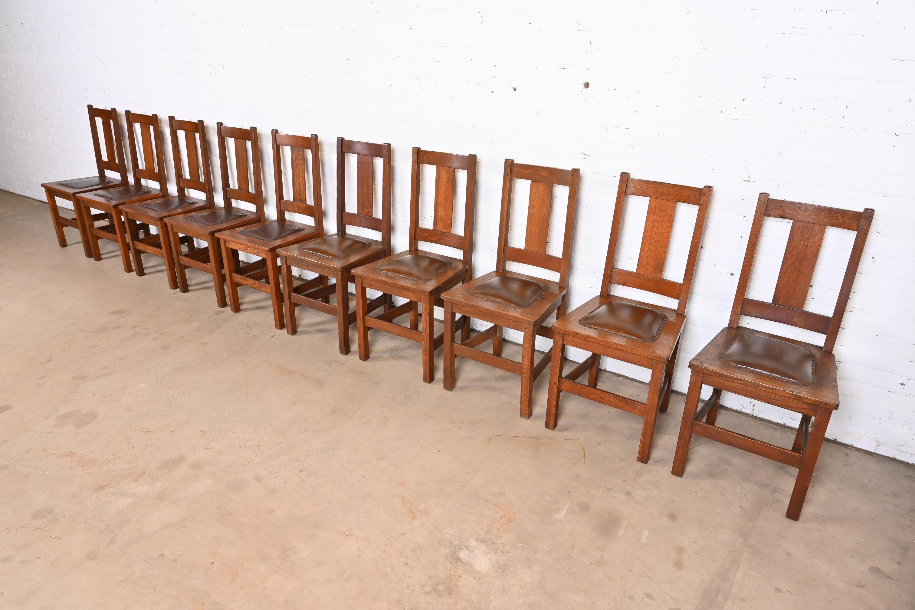 A rare and beautiful set of ten Mission or Arts & Crafts dining chairs

By Limbert

USA, Early 20th Century

Solid quarter sawn oak frames, with studded leather upholstered seats.

Measures: 17