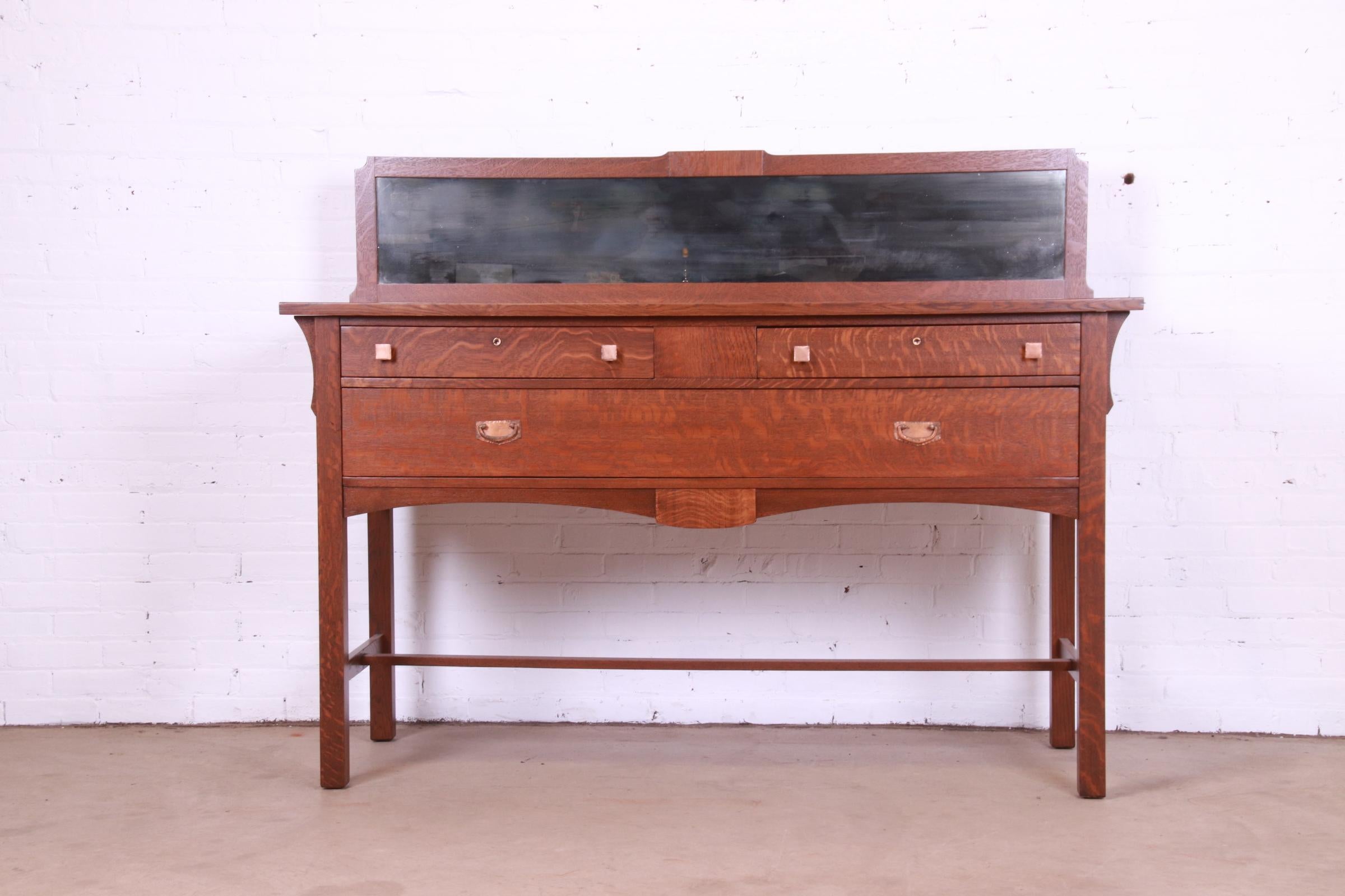 An exceptional Mission or Arts & Crafts sideboard, credenza, or buffet server

By Charles P. Limbert Co.

USA, Circa 1900

Quartersawn oak, with original copper hardware and mirrored backsplash.

Measures: 66