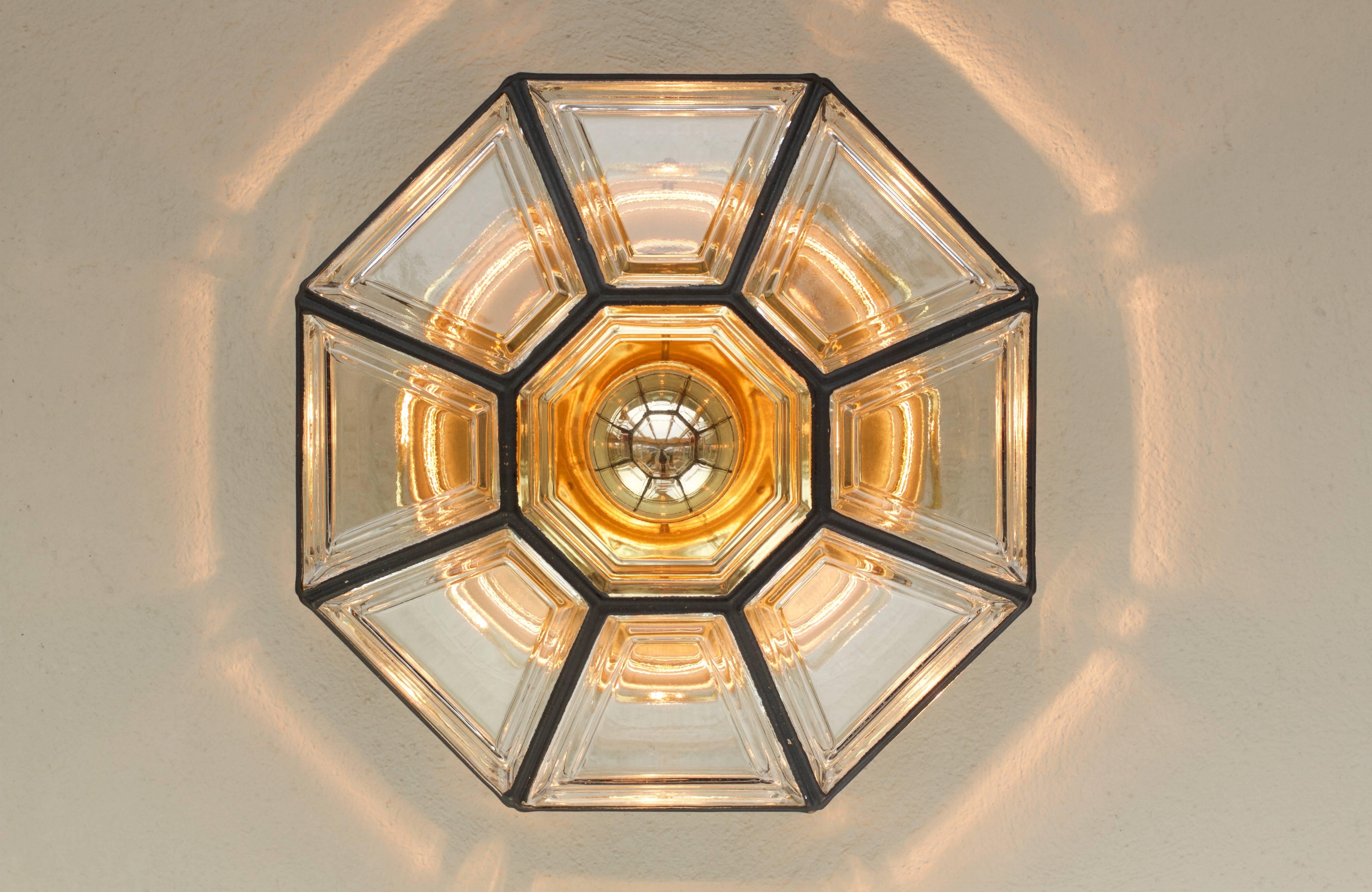 Vintage mid-century octagonally shaped, Minimalist German made flush mount light fixture produced by Glashütte Limburg, circa 1965. This Contemporary Art Deco and lantern style Plafonnier casts a fantastic light when mounted on the ceiling or wall