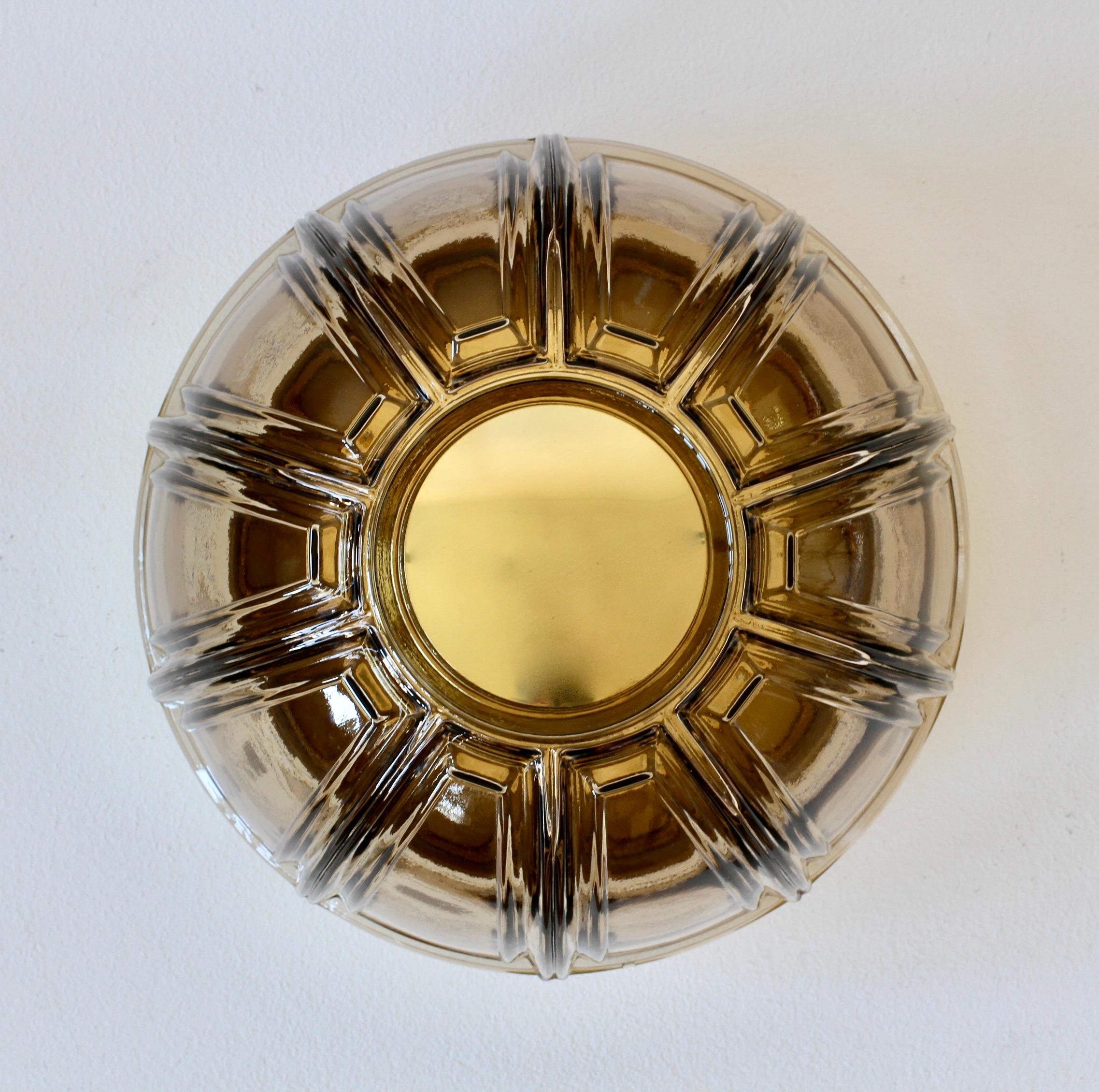 One of a set of five funky vintage midcentury wall lights or sconces by German lighting manufacturer Glashütte Limburg, circa 1975-1985. Featuring geometric shaped mouth blown topaz dark 