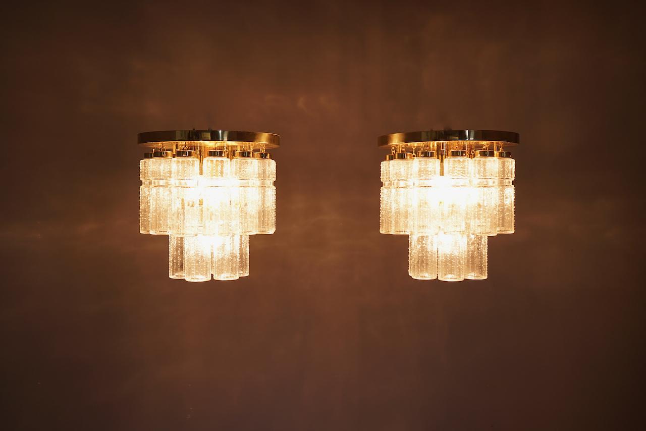 Two tiers flushmount chandleries in brass and glass by Limburg, Germany, 1970s. Two chandeliers are available.
Very good condition
