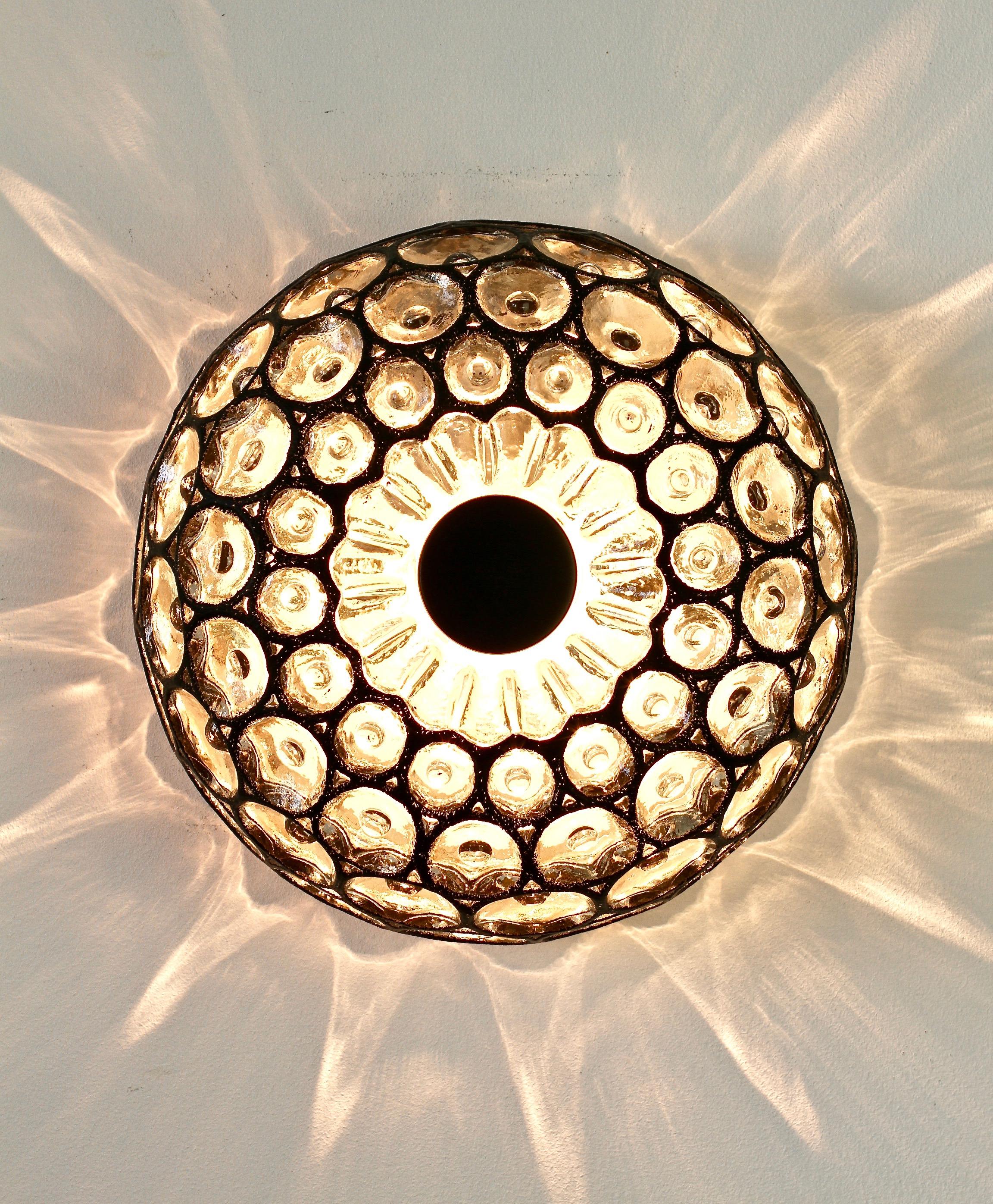 Limburg Glashütte domed shaped flush mount wall or ceiling light fixture made in Germany, circa 1965. The textured glass bulges slightly inwards of its black 