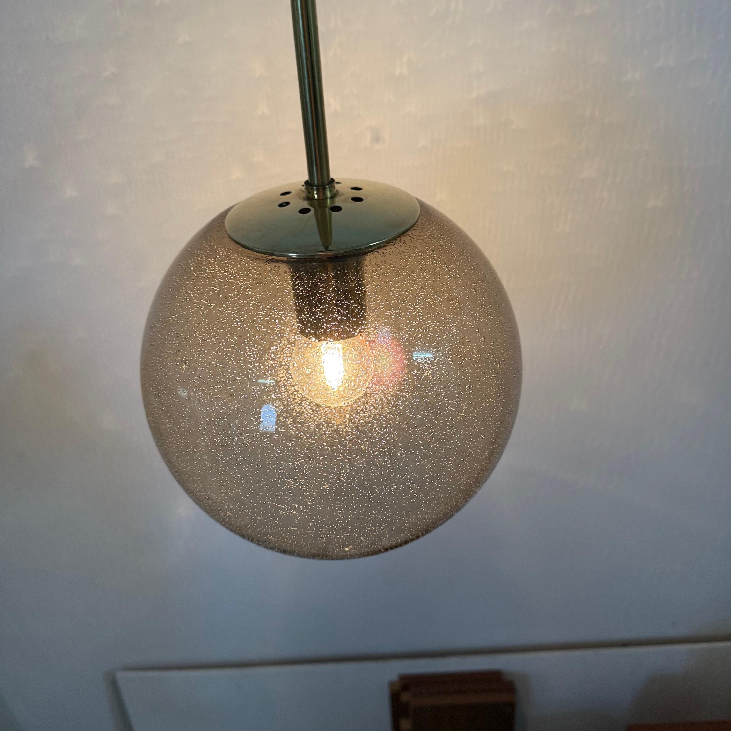 Limburg Glashütte brass smoked glass ball pendant hanging lamp , 1970s In condizioni buone in vendita a Delft, NL
