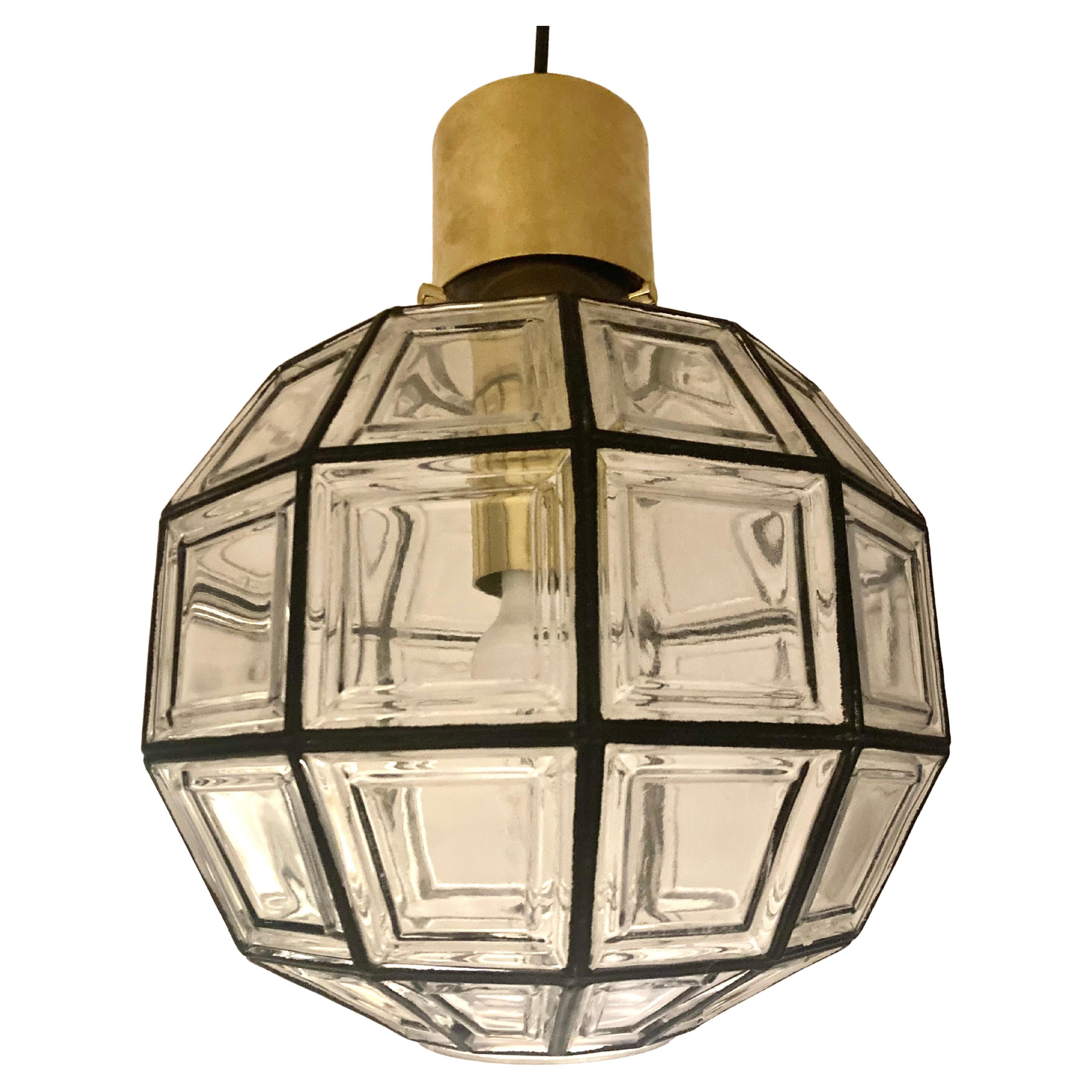 Clear glass and pendant lantern with an octogonal shape. 
One standard bulb. 
This lantern has an elegance combined with an industrial design. 
