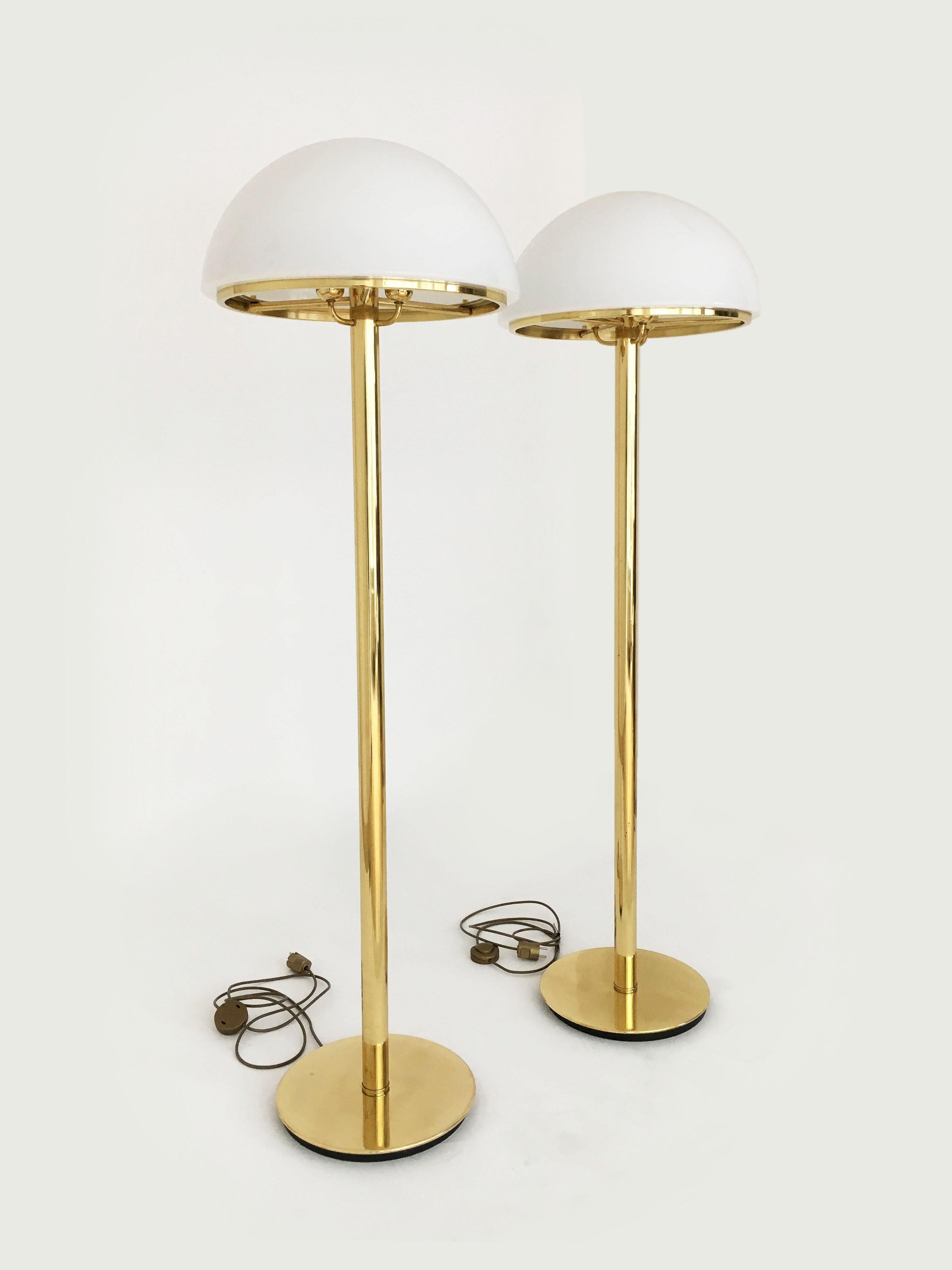A pair of impressive sized Glashütte Limburg mushroom floor lamps in brass with satin glass shade, Germany, 1970s. In the style of Karl Springer. As expected from a German manufactory, Glashütte Limburg, the lamps are superbly build quality - heavy