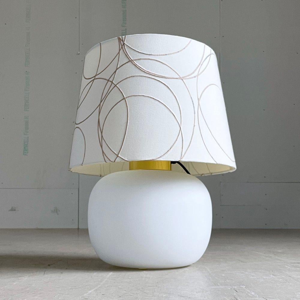Limburg Opaline Glass Table Lamp designed by Heinz-Josef Ohm, 1968. With brass stem. Three lighting options: Base only, Shade only or Base and Shade simultaneously. With Fabric Shade. Max 100W.
Designer: Heinz-Josef Ohm, 1968
Producer: Limburg,