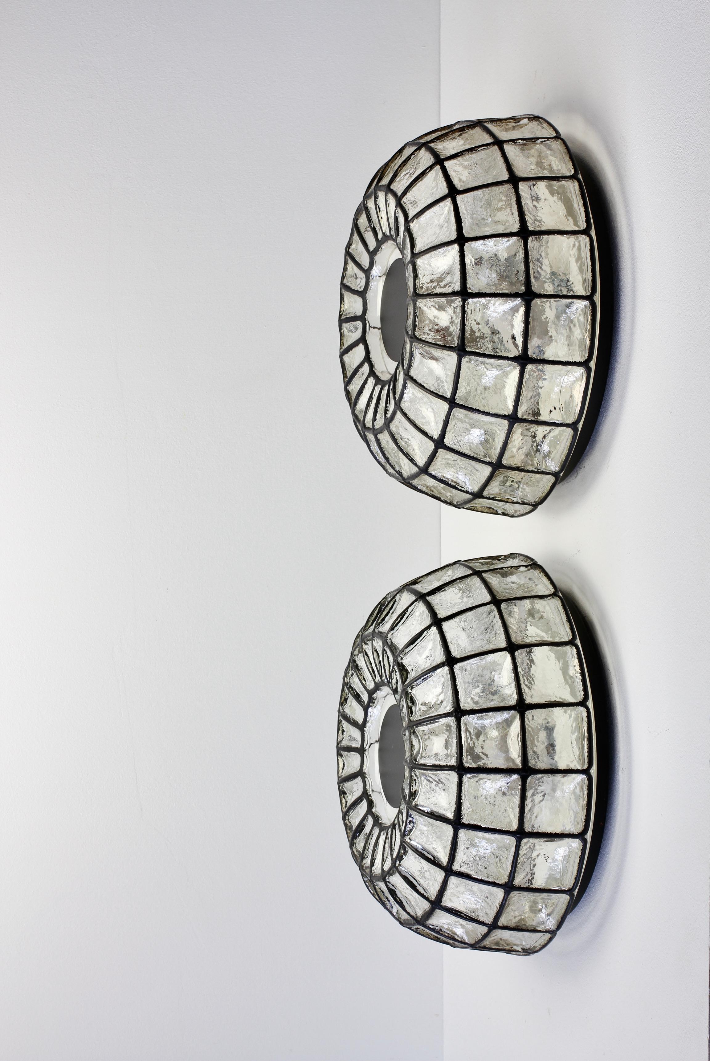 Pair of rare, extra large pair of Mid-Century Modern vintage minimal circular round domed geometric shaped flush mount wall or ceiling light / lamp fixtures by Glashütte Limburg, Germany, circa 1965. The honeycombed bubble glass bulges slightly