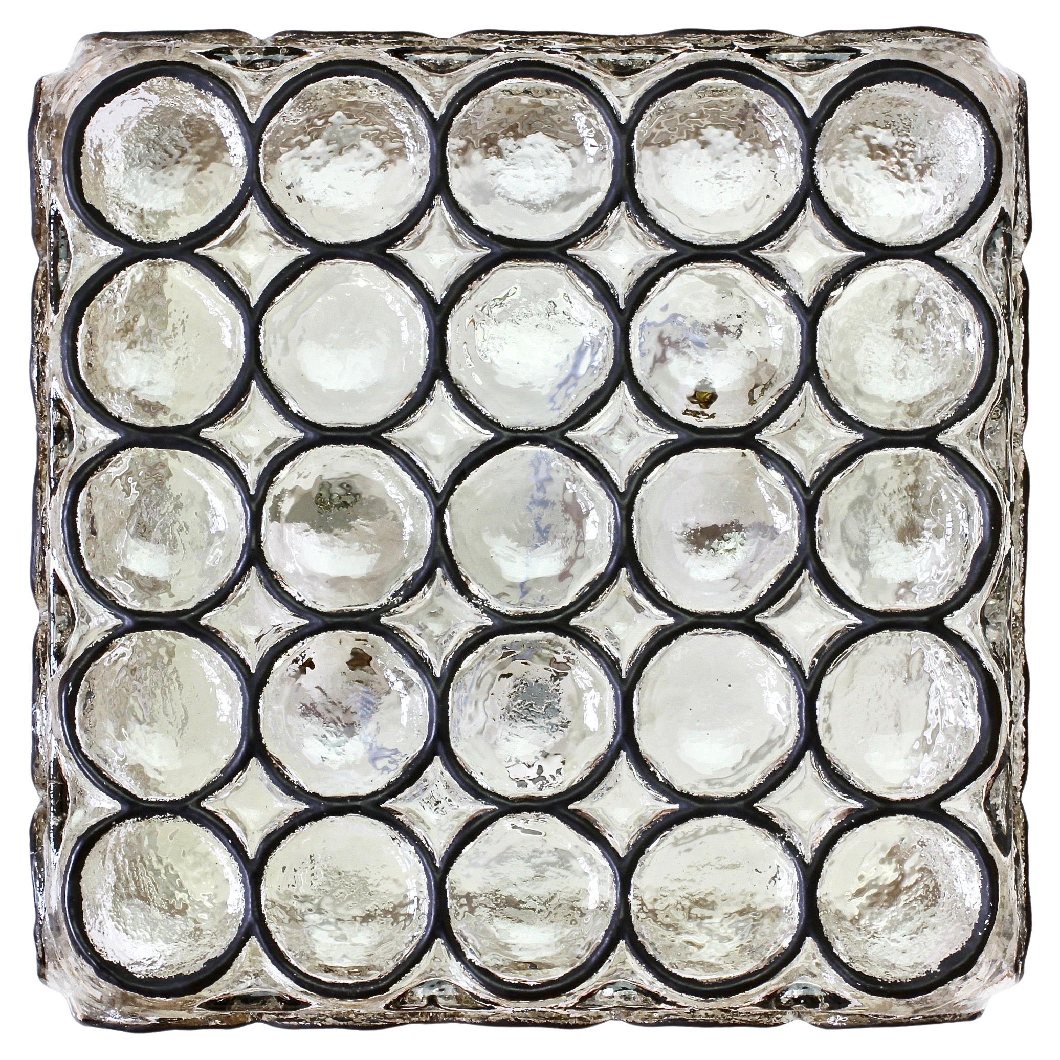 Pair of large vintage Mid-Century square iron rings and glass flush mount lights, sconces or lamps by Glashütte Limburg, Germany, circa 1965. Featuring thick heavy mouth blown glass with con-caved round iron