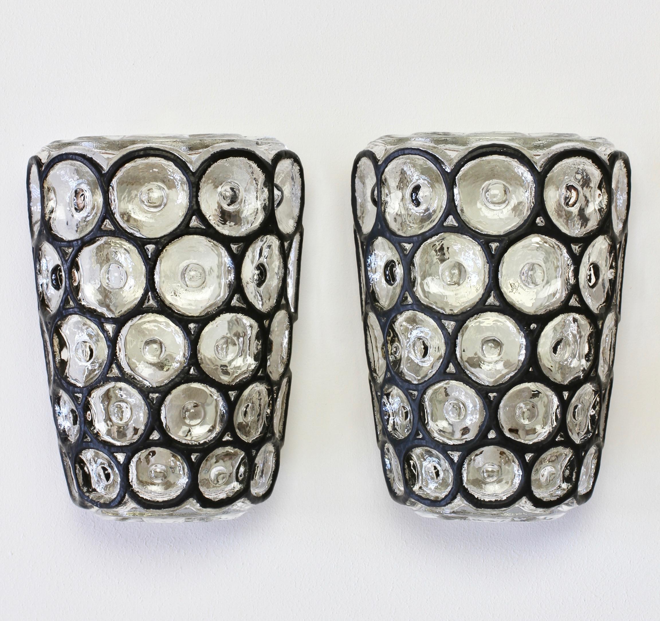 Pair of vintage Mid-Century Modern German made lantern style flushmount wall light fixtures or sconces by Glashütte Limburg, circa 1960. They can be wall-mounted and directly wired or used in conjunction with pull switches. New pull cords can be