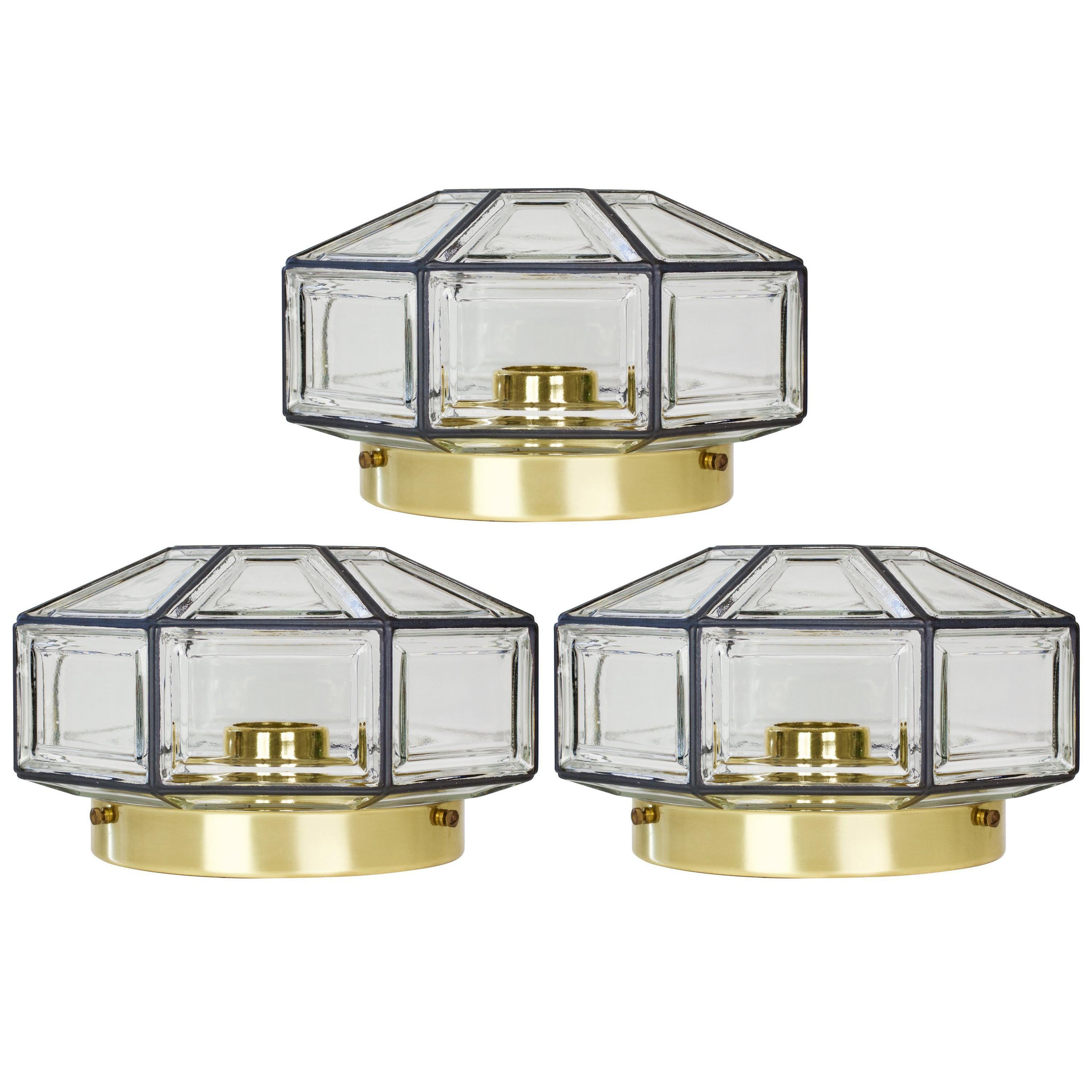 Pair of vintage midcentury octagonally shaped, Minimalist German made flushmount lamp produced by Glashütte Limburg, circa 1965. This Contemporary Art Deco and lantern style flushmount fixture casts a fantastic light when mounted on the ceiling or