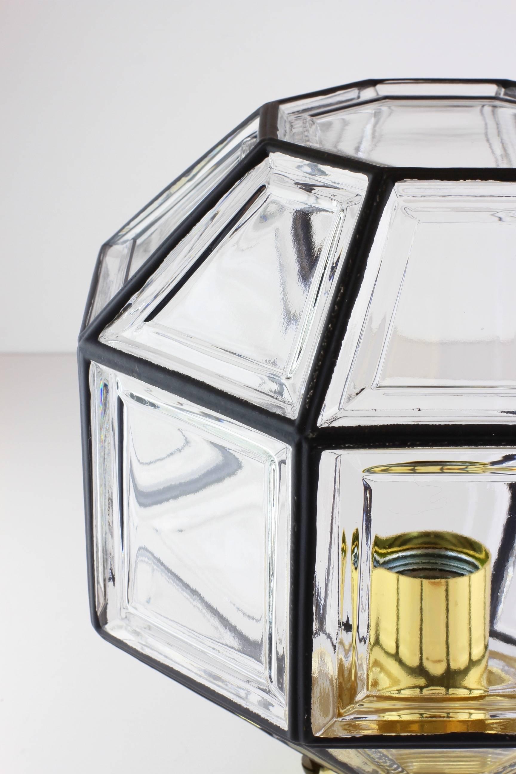Set of three octagonally shaped, midcentury Minimalist German made pair of large flush mount lights produced by Glashütte, Limburg, circa 1965. These Contemporary Art Deco and lantern style lamps casts a fantastic light when mounted on the ceiling