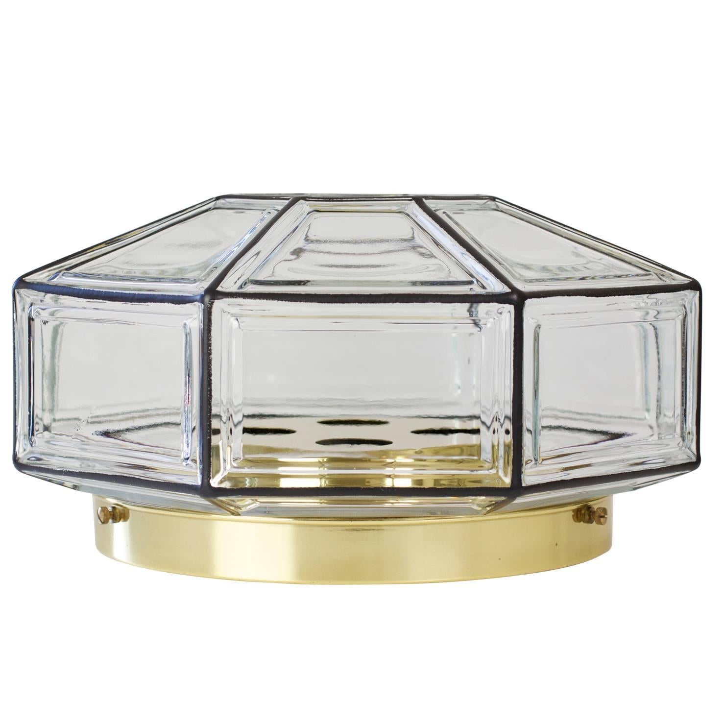 An extra large octagonally shaped, Mid-Century Modern and Minimalist German made flushmount light fixture produced by Glashütte Limburg, circa 1965. This Contemporary Art Deco and lantern style ceiling lamp casts a fantastic light when mounted on