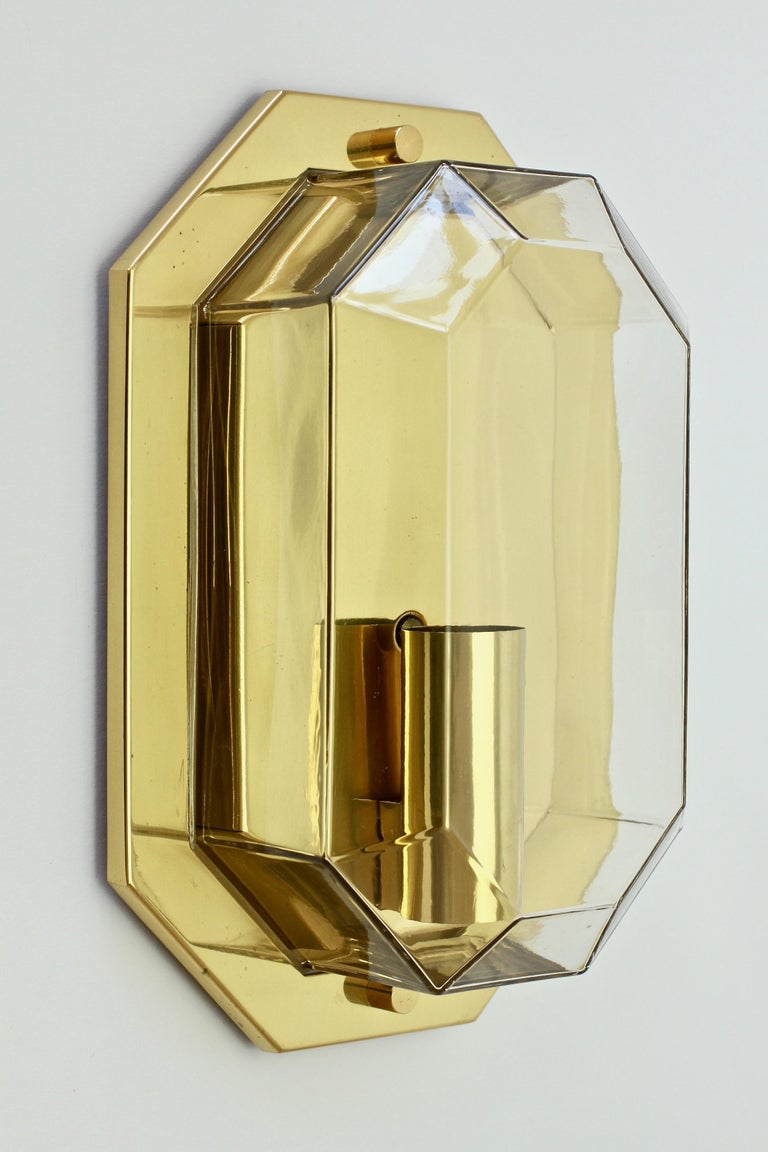 Stunning and elegant pair of vintage Lozenge shaped wall lights by Glashütte Limburg, circa 1975-1985. Featuring geometric shaped mouth blown clear glass elements with polished brass cases or mounts.

Wall-mounted with flush mounts, each light