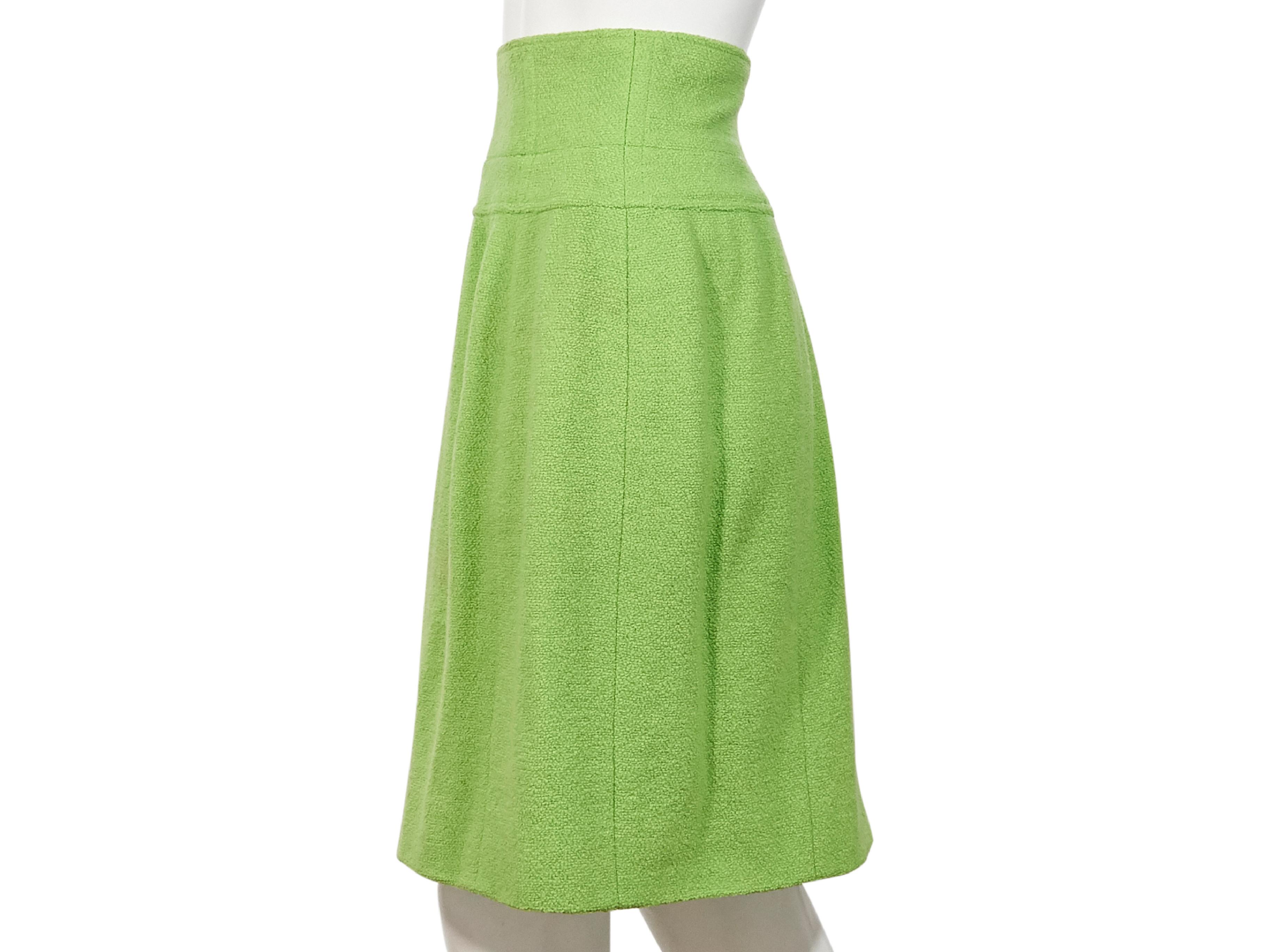Product details:  Lime green wool skirt by Chanel.  From the FW 95 collection.  Wide banded waist.  Concealed back zip closure.  Label size FR 40.  29