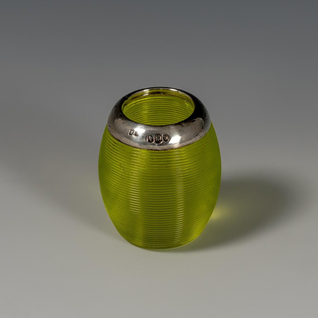 A small lime colored ovoid shaped glass match striker with silver collar, hallmarked London, 1906.

Dimensions: 3.25 cm/1¼ inches (max. diameter) x 4 cm/1⅝ inches (height)

Bentleys are Members of LAPADA, the London and Provincial Antique Dealers