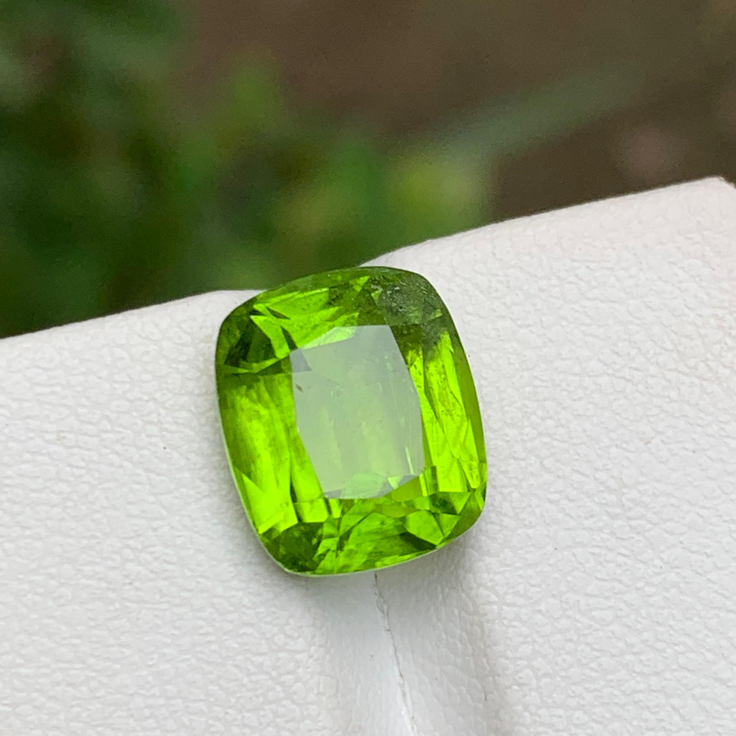 GEMSTONE TYPE: Natural Peridot
PIECE(S): 1
WEIGHT: 6.85 Carats
SHAPE & Cut: Cushion Cut
SIZE (MM): 11.83 x 10.08 x 6.79
COLOR: Lime Green
CLARITY: Slightly Included 
TREATMENT: None
ORIGIN: Pakistan
CERTIFICATE: On demand
(if you require a
