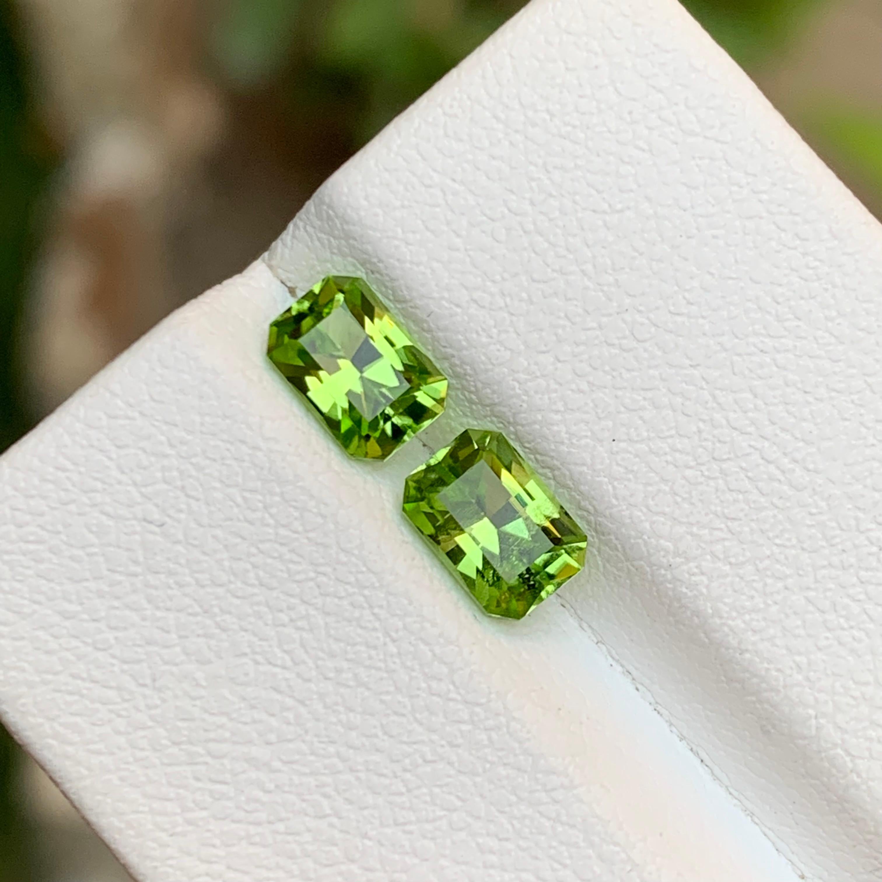 GEMSTONE TYPE: Natural Peridot 
PIECE(S): 2
WEIGHT: 1.95 Carats
SHAPE: Emerald
SIZE (MM): 
0.95 Ct: 6.61 x 4.59 x 3.77
1.00 Ct: 6.65 x 4.67 x 3.77
COLOR: Lime Green
CLARITY: Approximately Eye Clean
TREATMENT: None
ORIGIN: Pakistan 
CERTIFICATE: On