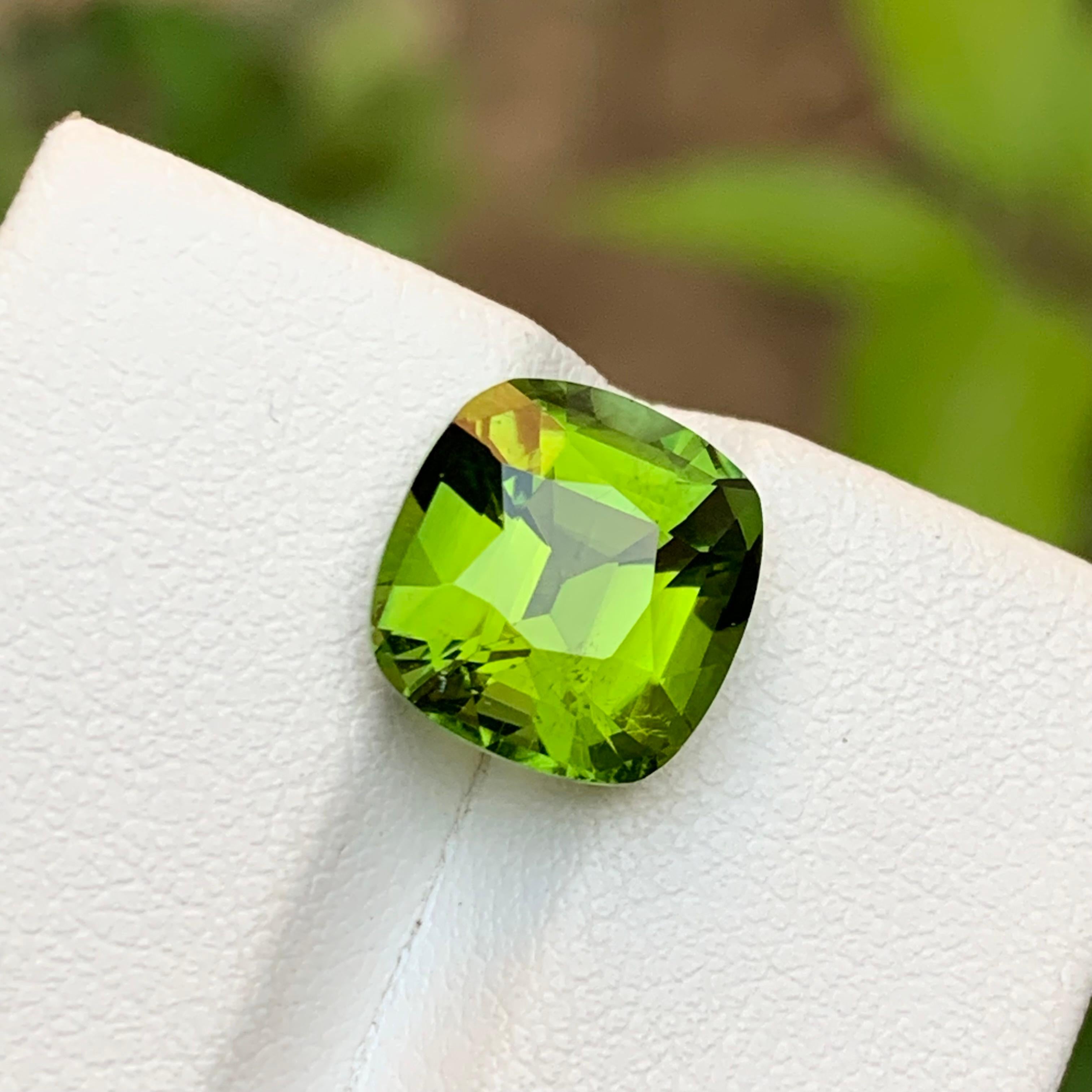 💎 GEMSTONE TYPE: Tourmaline
⚖️ WEIGHT: 5.00 Carats
🪚 SHAPE & CUT: Step Cushion Cut
📏 SIZE (MM): 10.45 x 9.86 x 7.16
🌈 COLOR: Lime Green
🔎 CLARITY: Slightly Included 
🧪 TREATMENT: None (100% Natural)
🌍 ORIGIN: Afghanistan 
💳 CERTIFICATE: